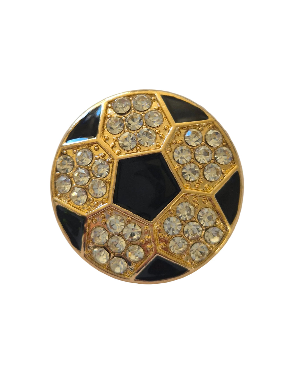 Rhinestone football brooch with gold and black detail on a white background,