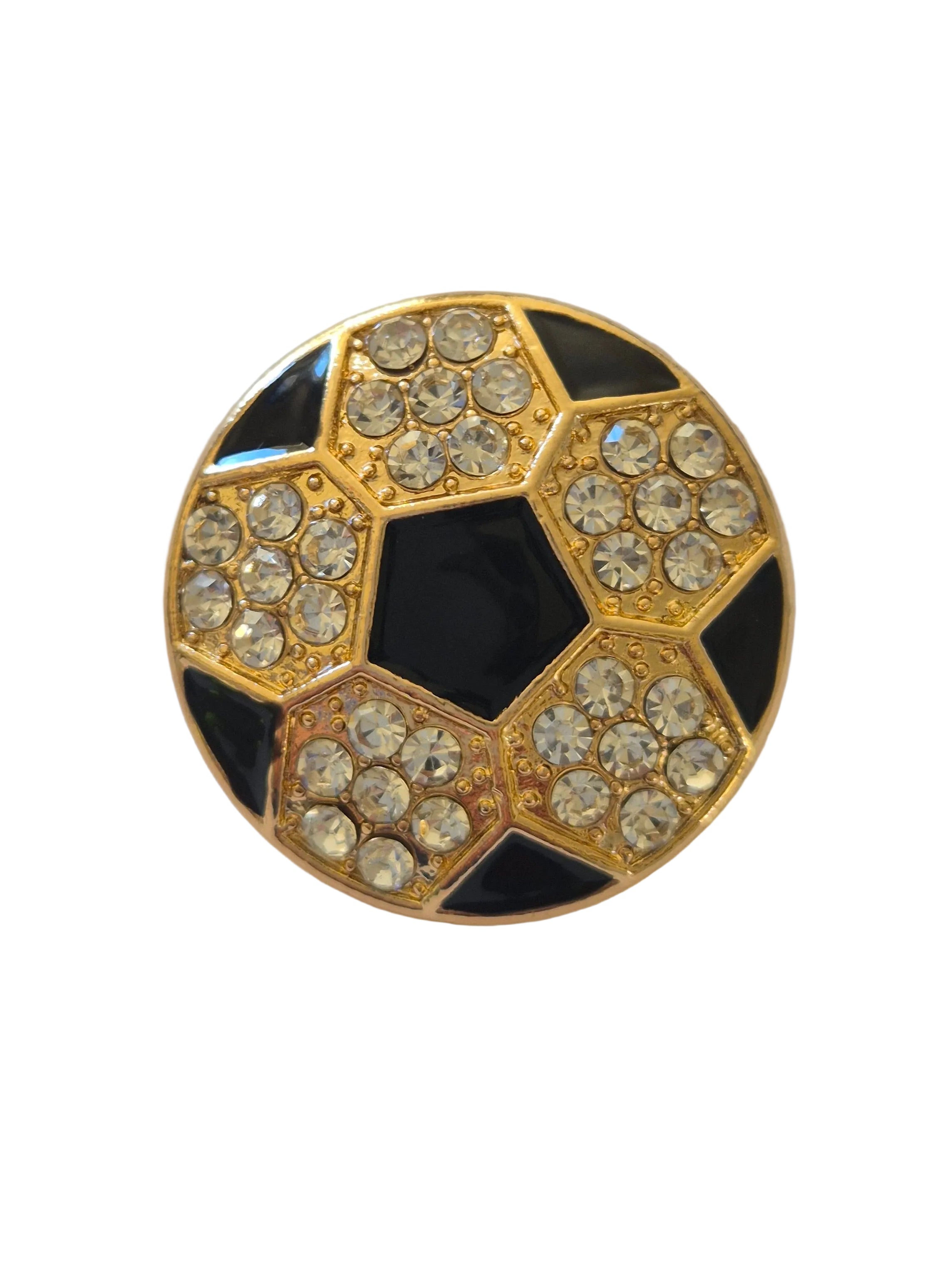 Rhinestone football brooch with gold and black detail on a white background,