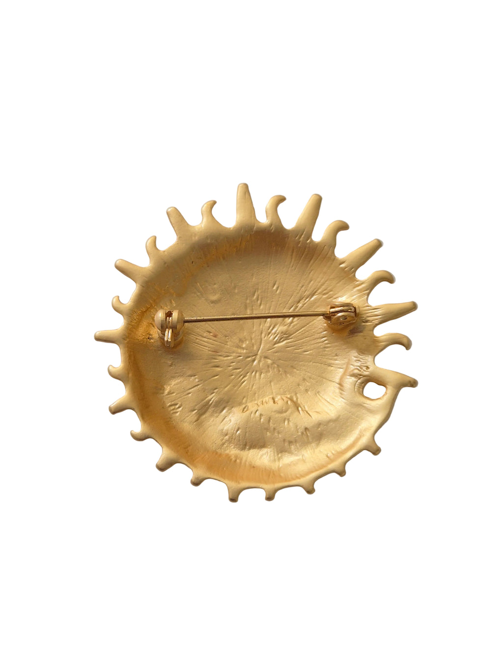 Gold sun moon brooch on a white background