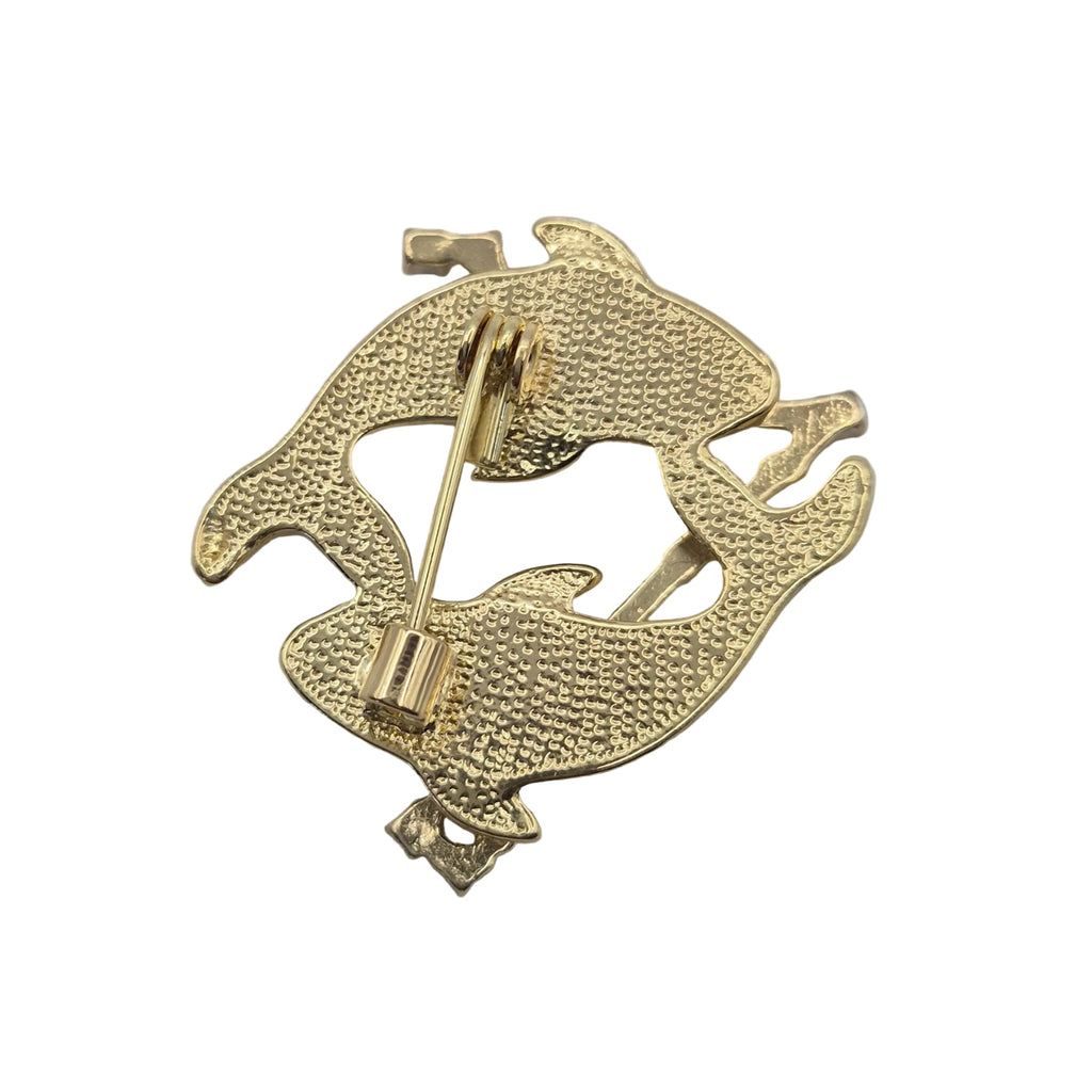 Reverse gold tone side of Pisces horoscope brooch showing pin mechanism Displayed on a plain white background
