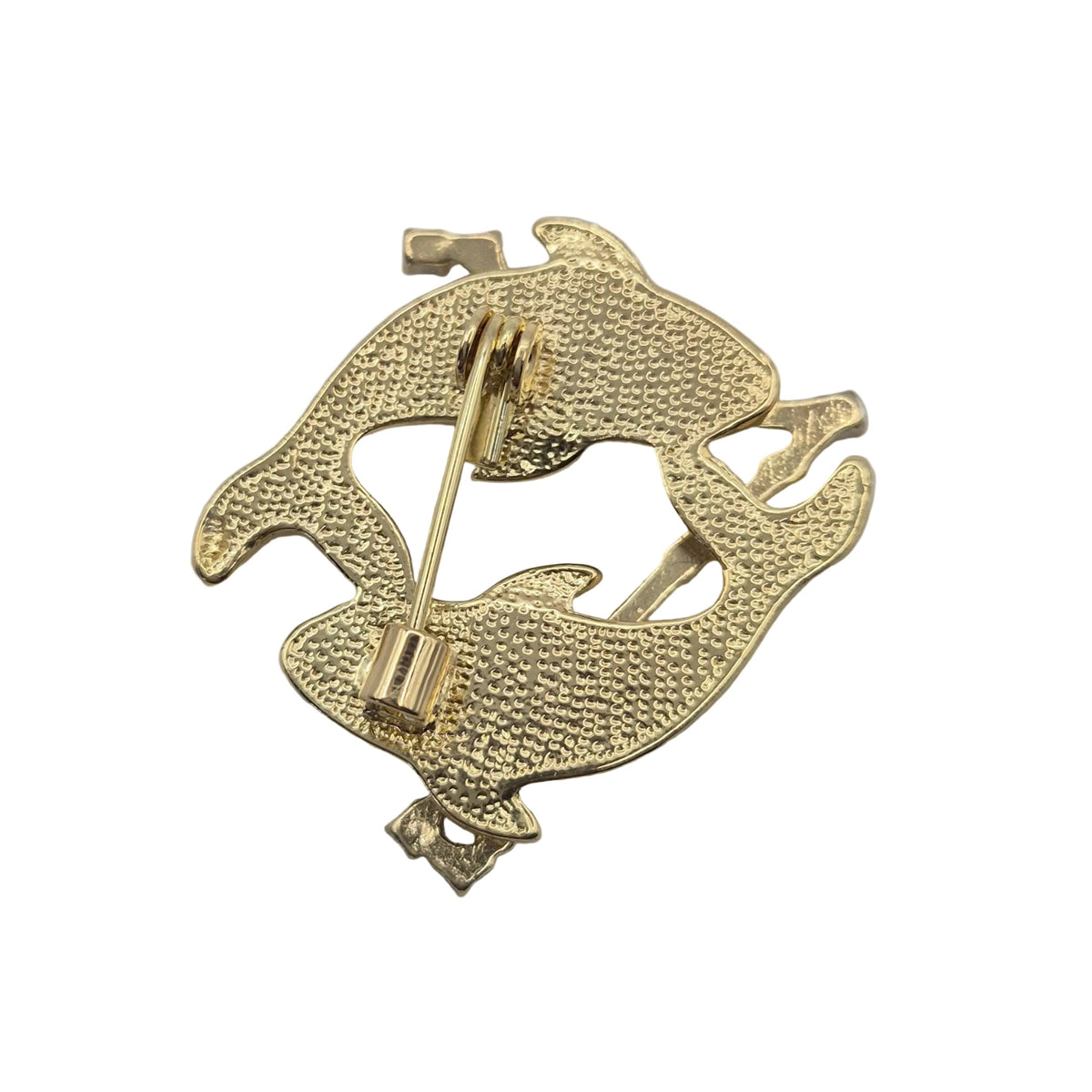 Reverse gold tone side of Pisces horoscope brooch showing pin mechanism Displayed on a plain white background