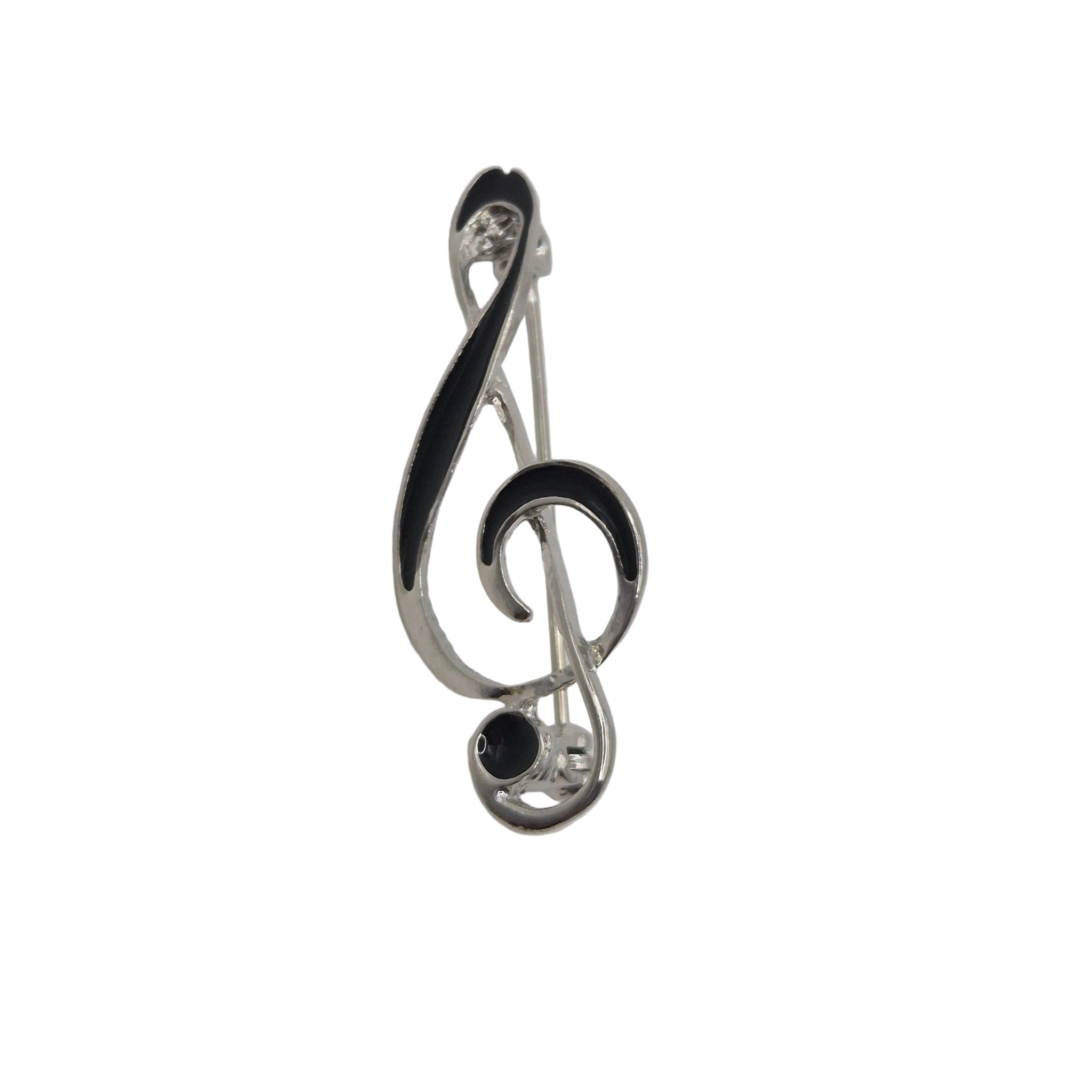 A silver treble clef pin with black enamel accents, photographed on a plain white background.
