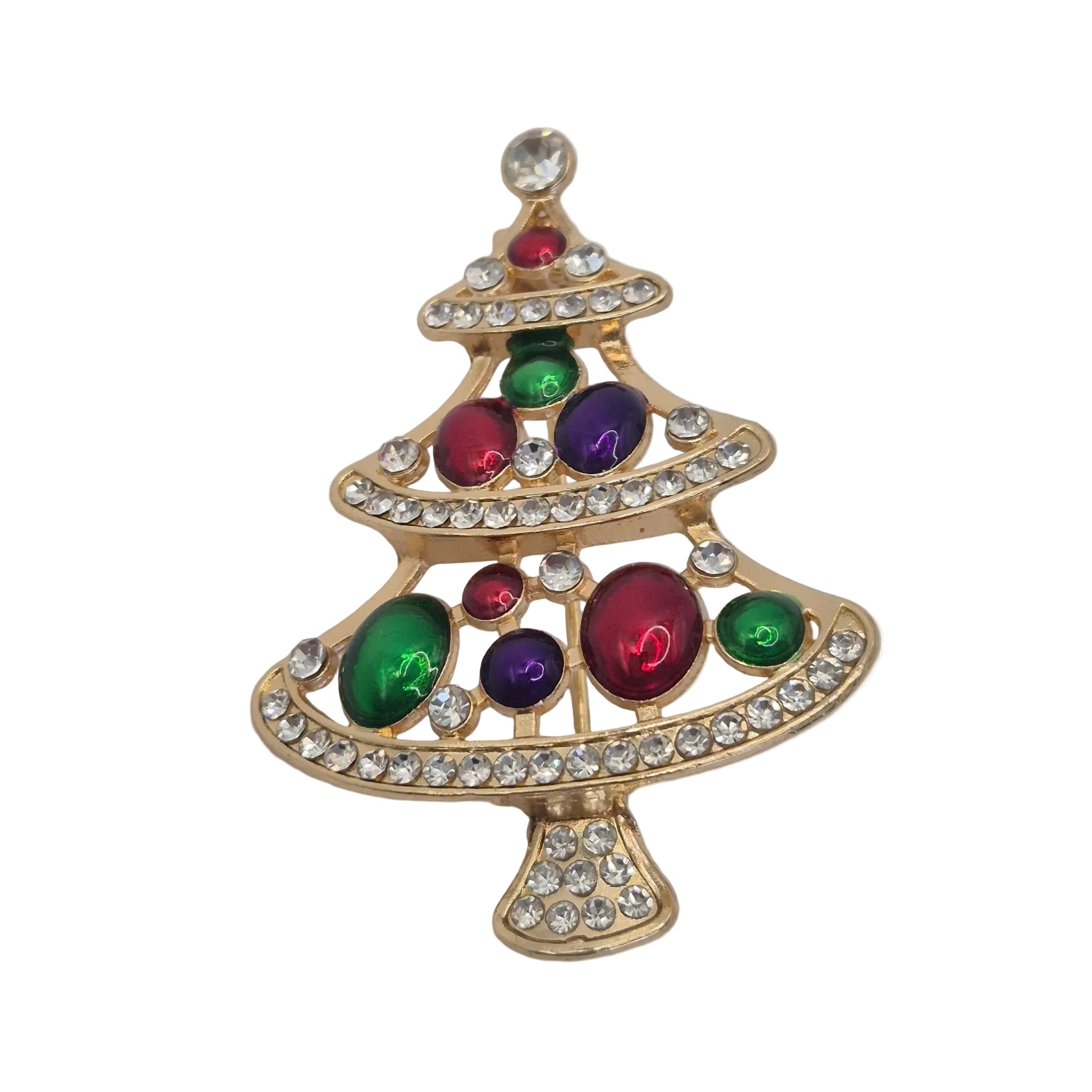 A gold Christmas tree-shaped brooch decorated with green, purple, and red faux jewels and clear rhinestones, shown on a plain white background.