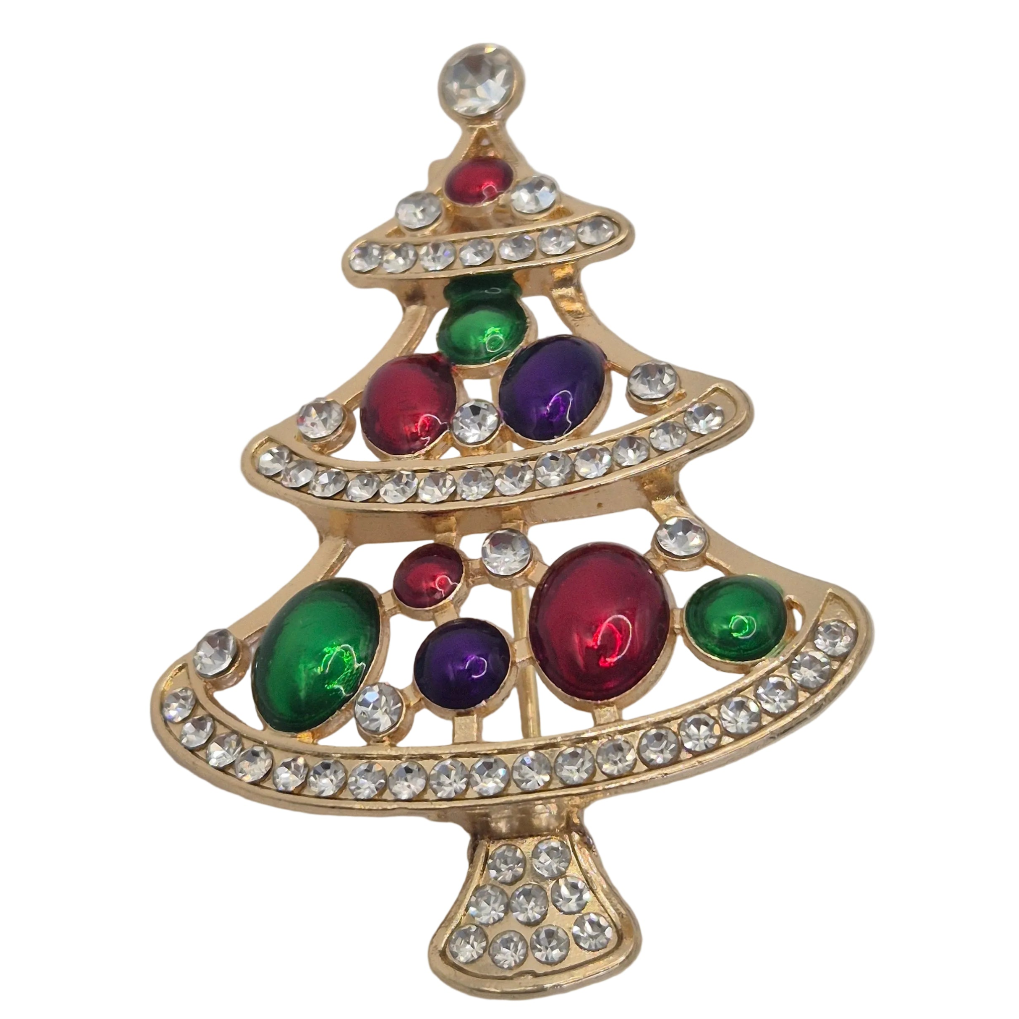 A gold Christmas tree-shaped brooch decorated with green, purple, and red enamel stones and clear rhinestones, shown on a plain white background.