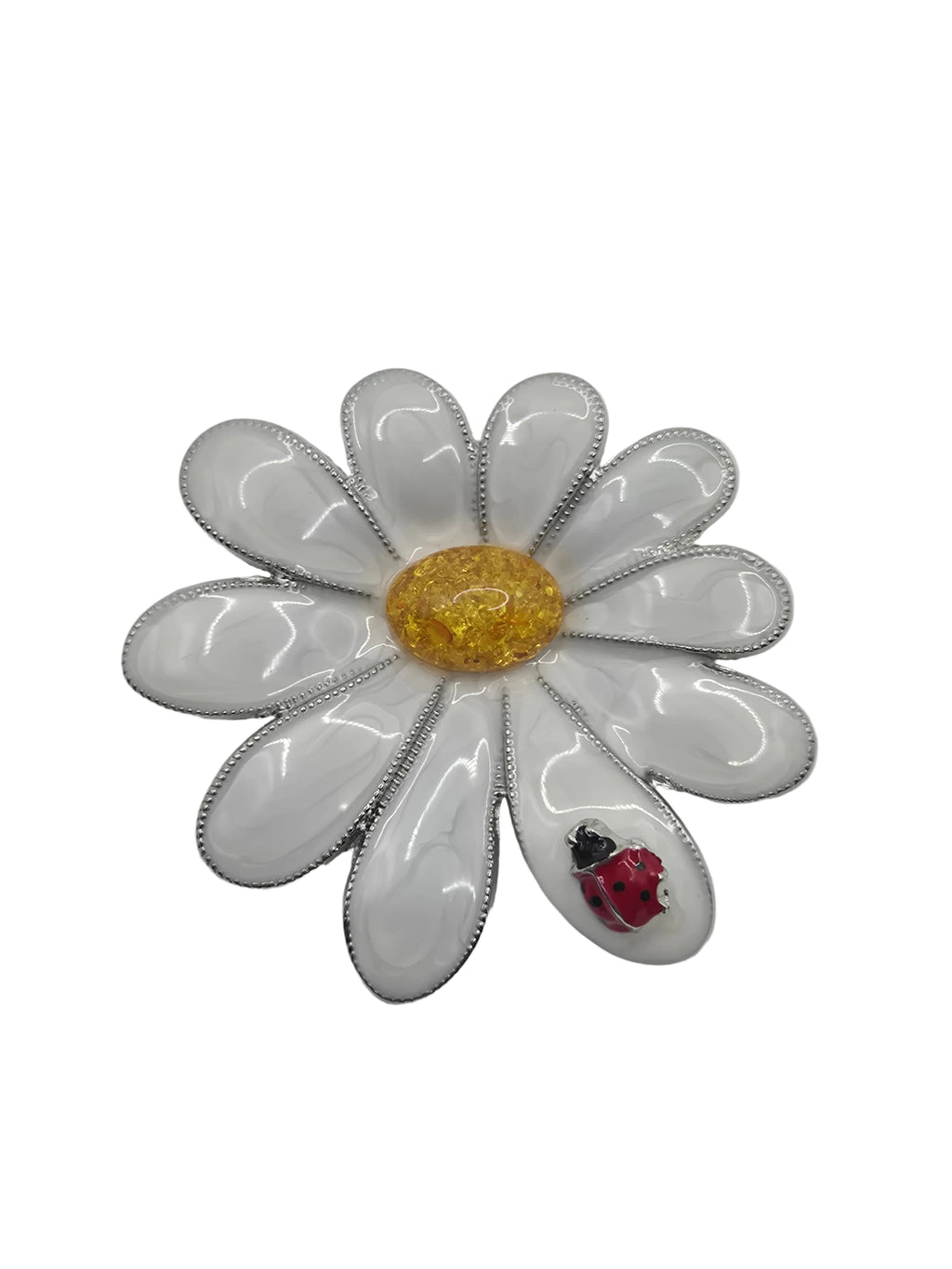Floral Daisy brooch with white petals, gold center, and red ladybug on a gray background