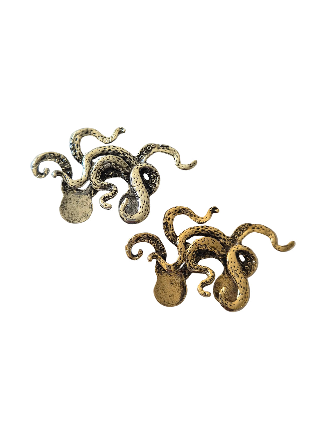 gold silver octopus brooch on a white background