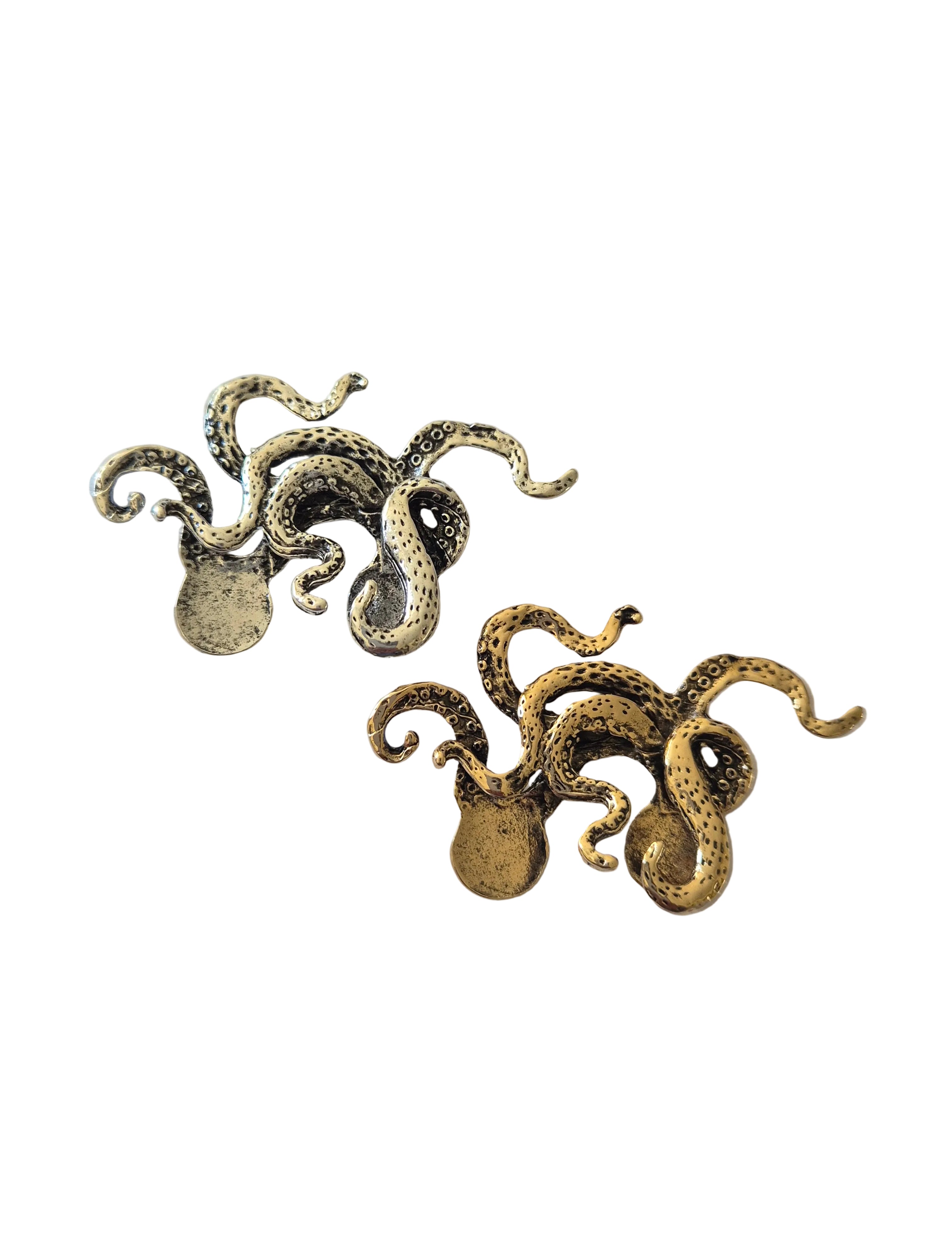 gold silver octopus brooch on a white background