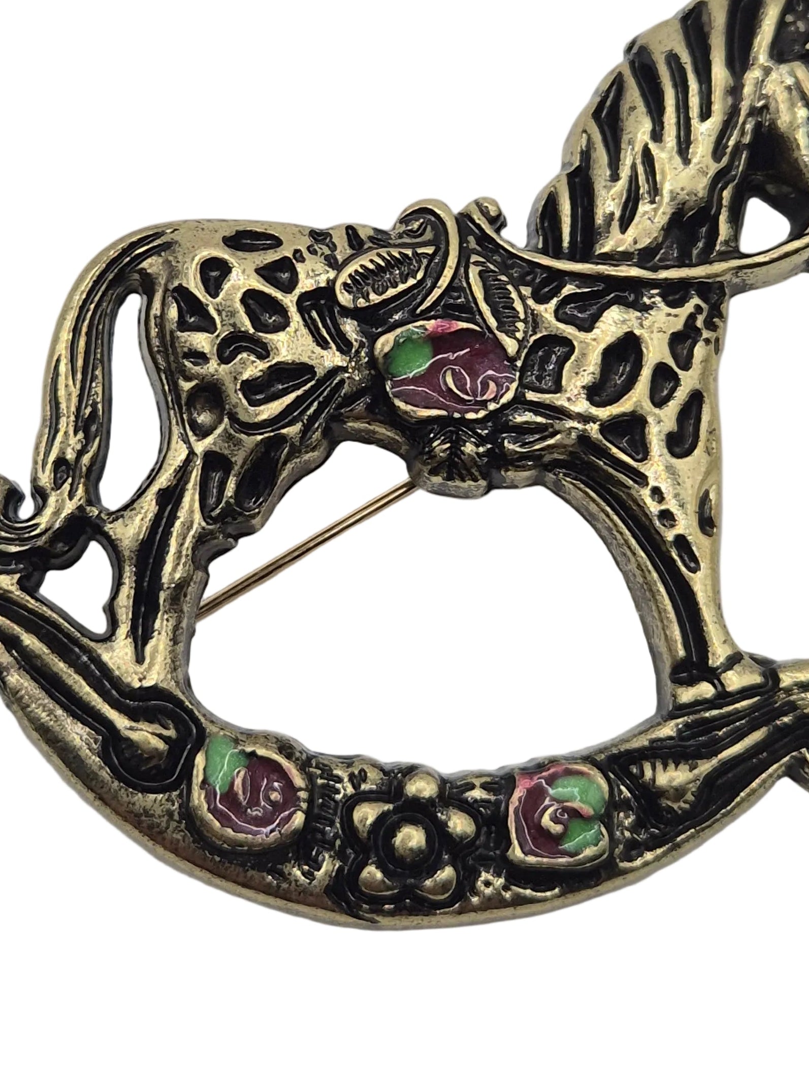 Antique gold tone metal rocking horse brooch