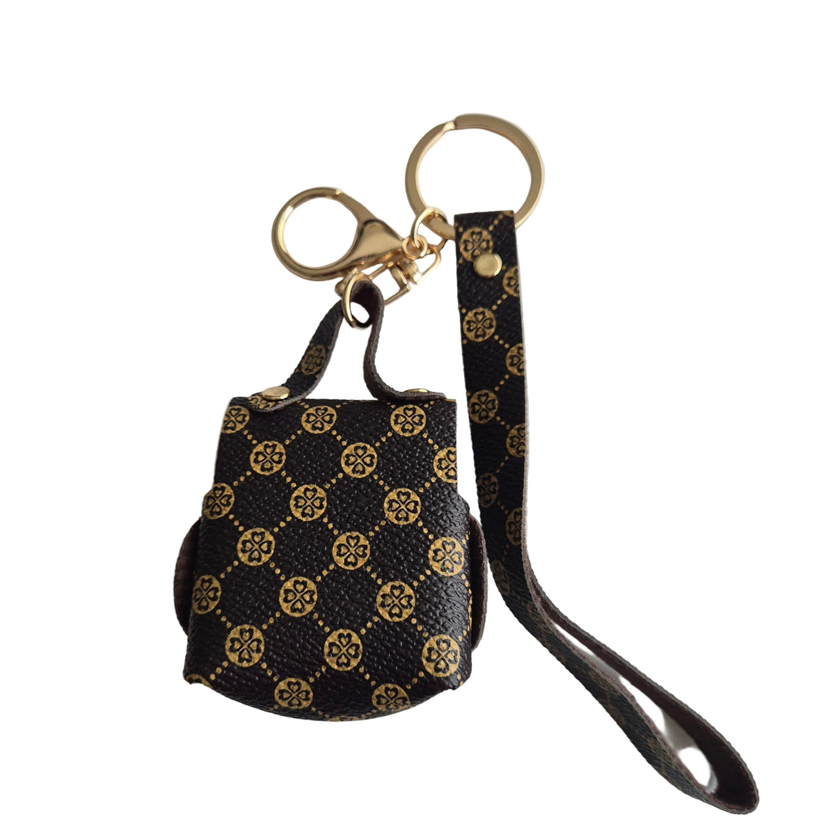 A small brown and gold monogram keychain bag with a matching wrist strap, attached to gold-tone split rings and a clasp, photographed on a plain light background.