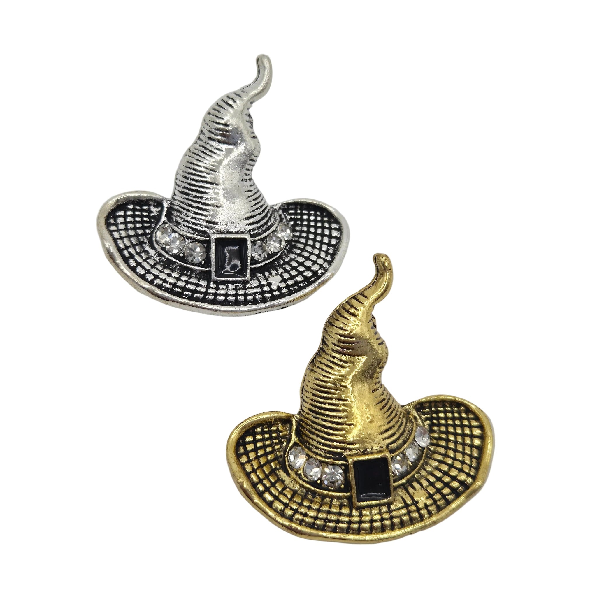 Two witch hat brooch pins shown on a plain white background, one in silver-tone metal and one in gold-tone metal, both with black textured detailing, a black rectangular center, and small clear rhinestone accents.