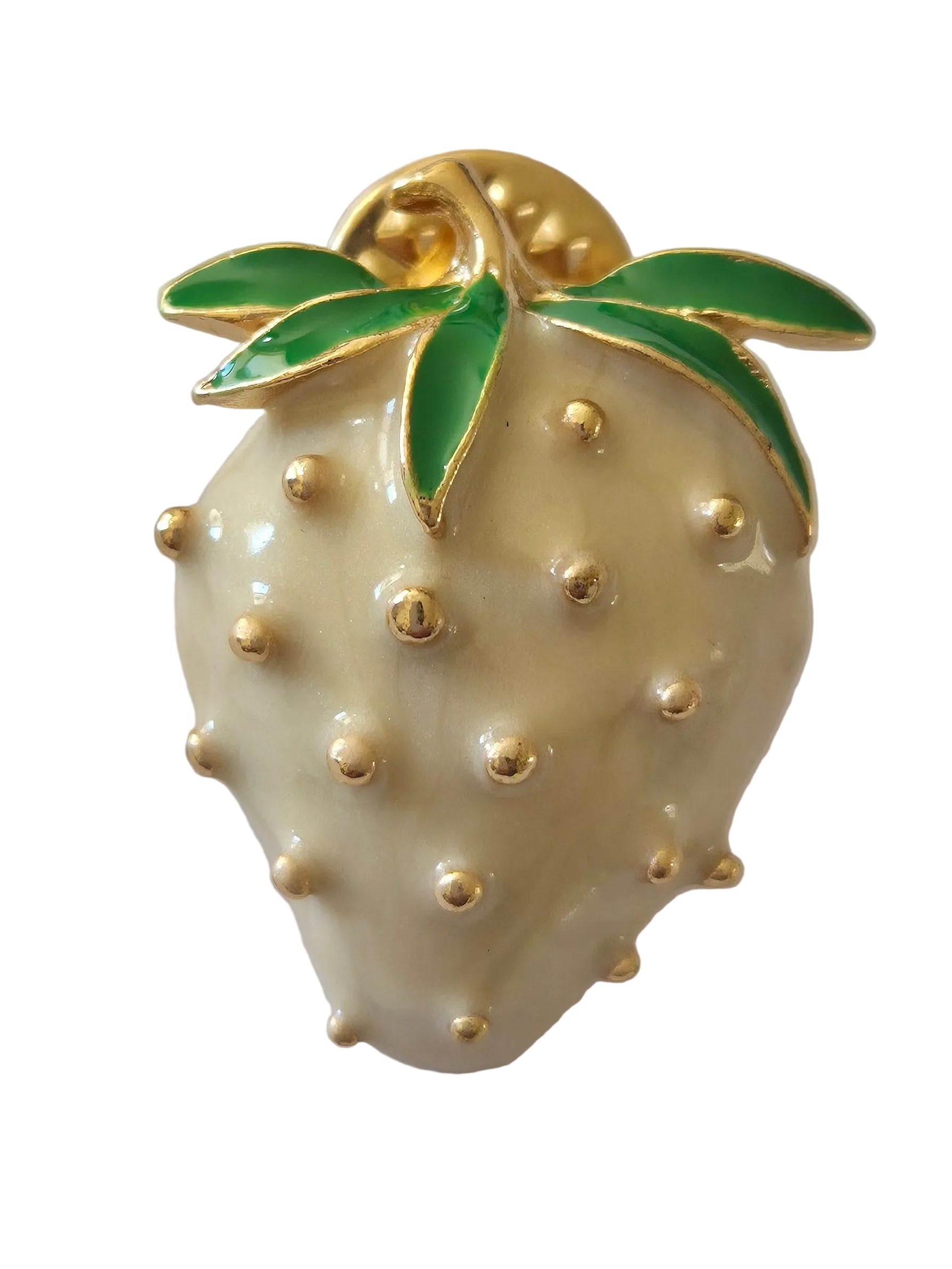 Decorative strawberry brooch with gold accents on a white background