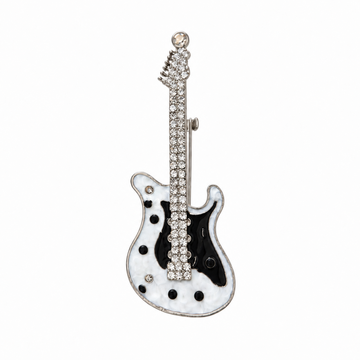 A guitar-shaped brooch featuring a white  body with black accents, a black pickguard, and a silver-tone neck and headstock embellished with clear rhinestones, shown on a plain white background.