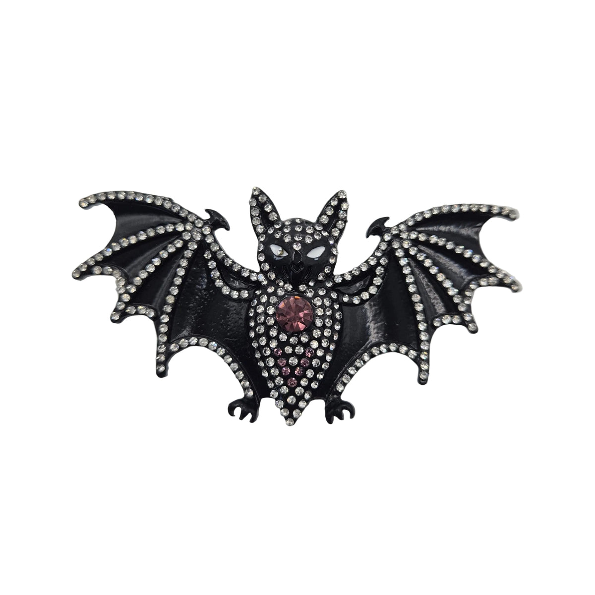 A gothic-style bat brooch or pin featuring a black enamel body, silver rhinestone-embellished wings and outline, and a small red gemstone at the centre, shown on a plain white background.