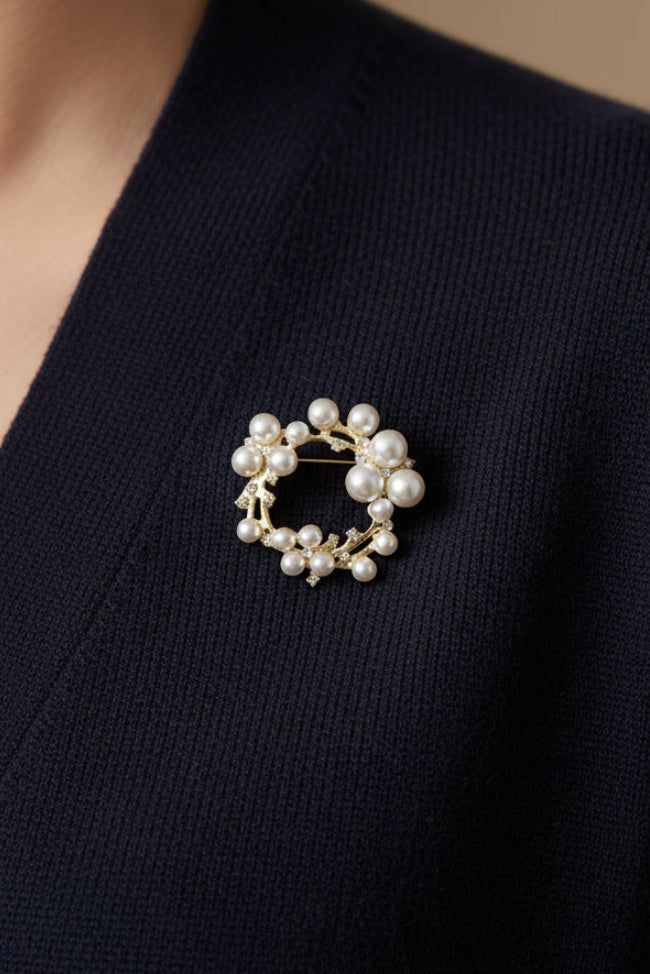 Pearl brooch on a black sweater