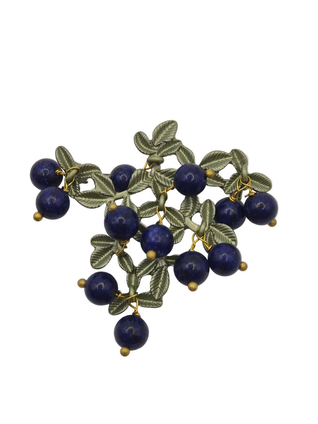 Brooch with blue berries and green leaves on a white background