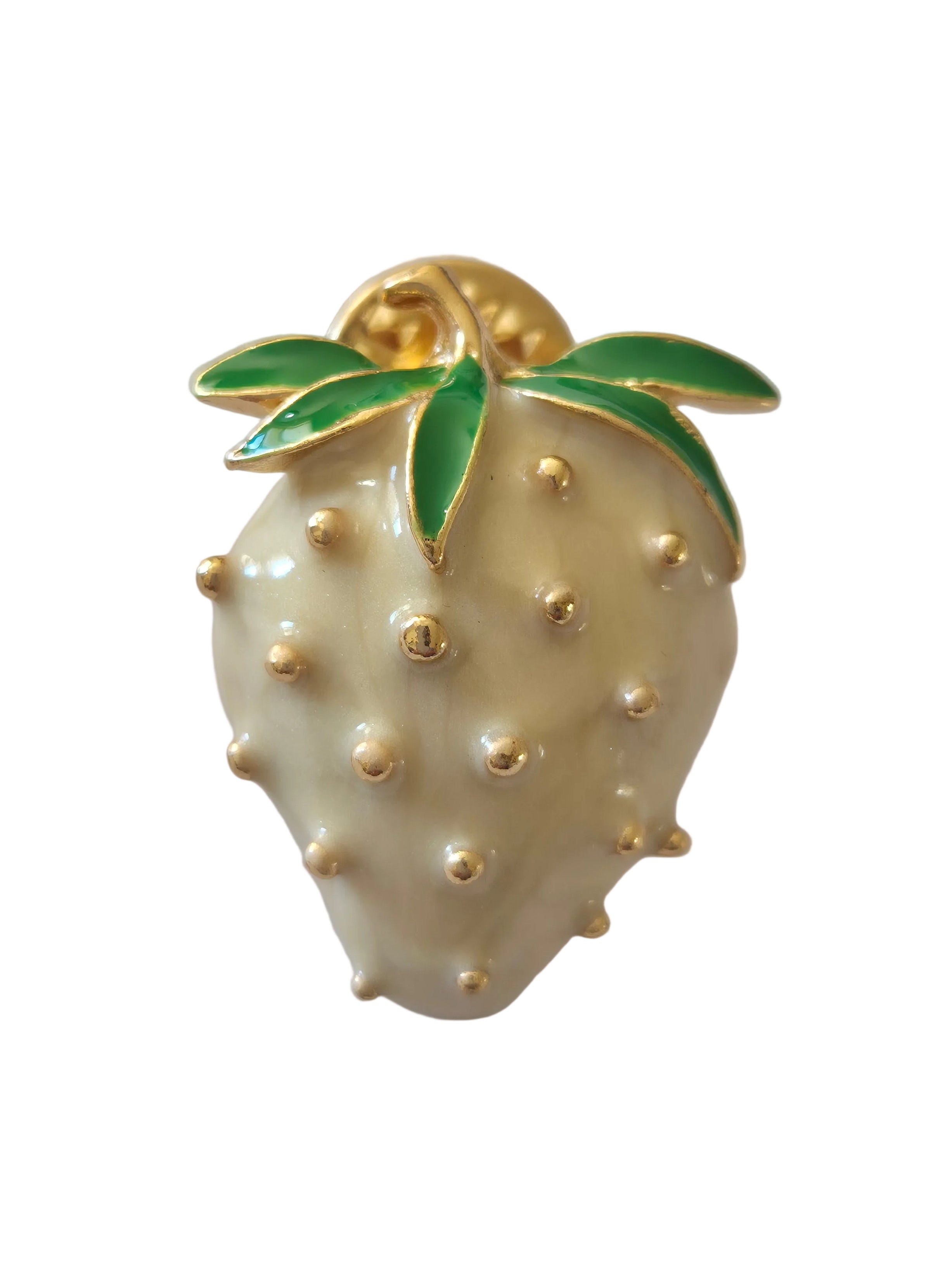 Gold and pearl-like strawberry fruit-shaped brooch on a white background