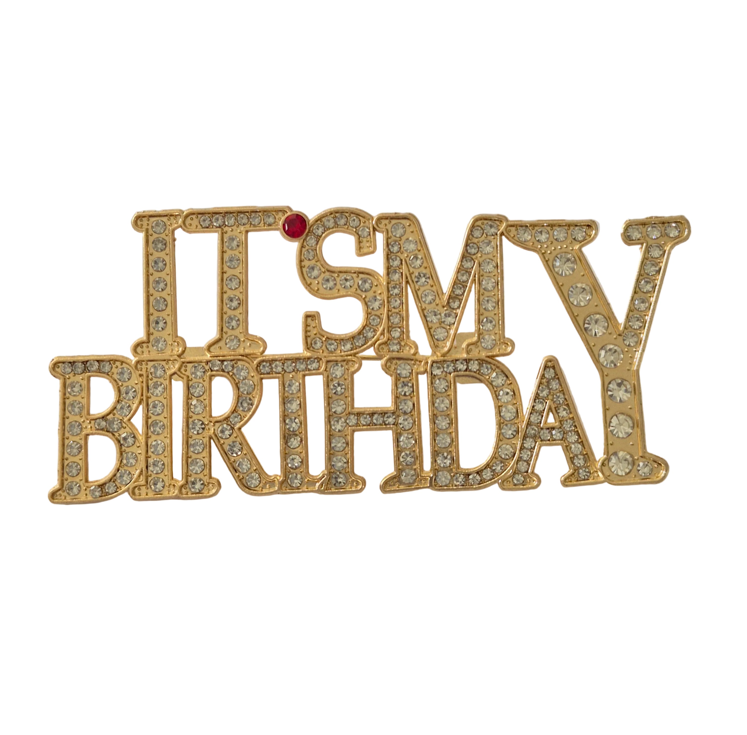 Gold 'It's My Birthday' brooch with rhinestones on a light gray background