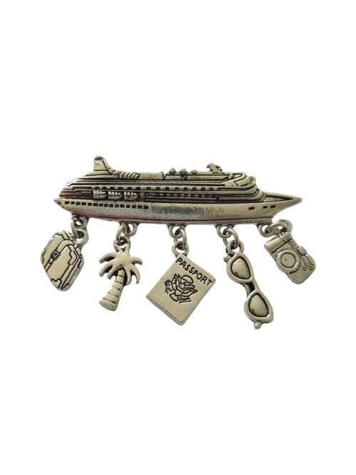 Silver charm brooch with various charms on a light gray background