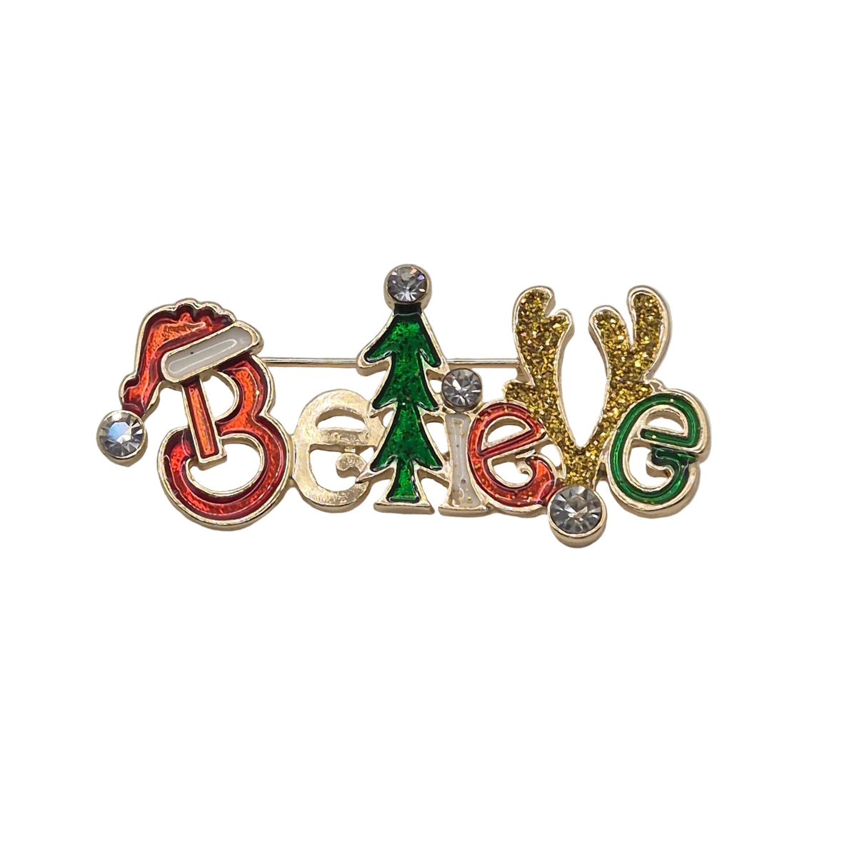 A festive enamel pin spelling out 'Believe' with a red Santa hat, green Christmas tree, and gold reindeer antlers, embellished with small clear rhinestones, on a plain white background.