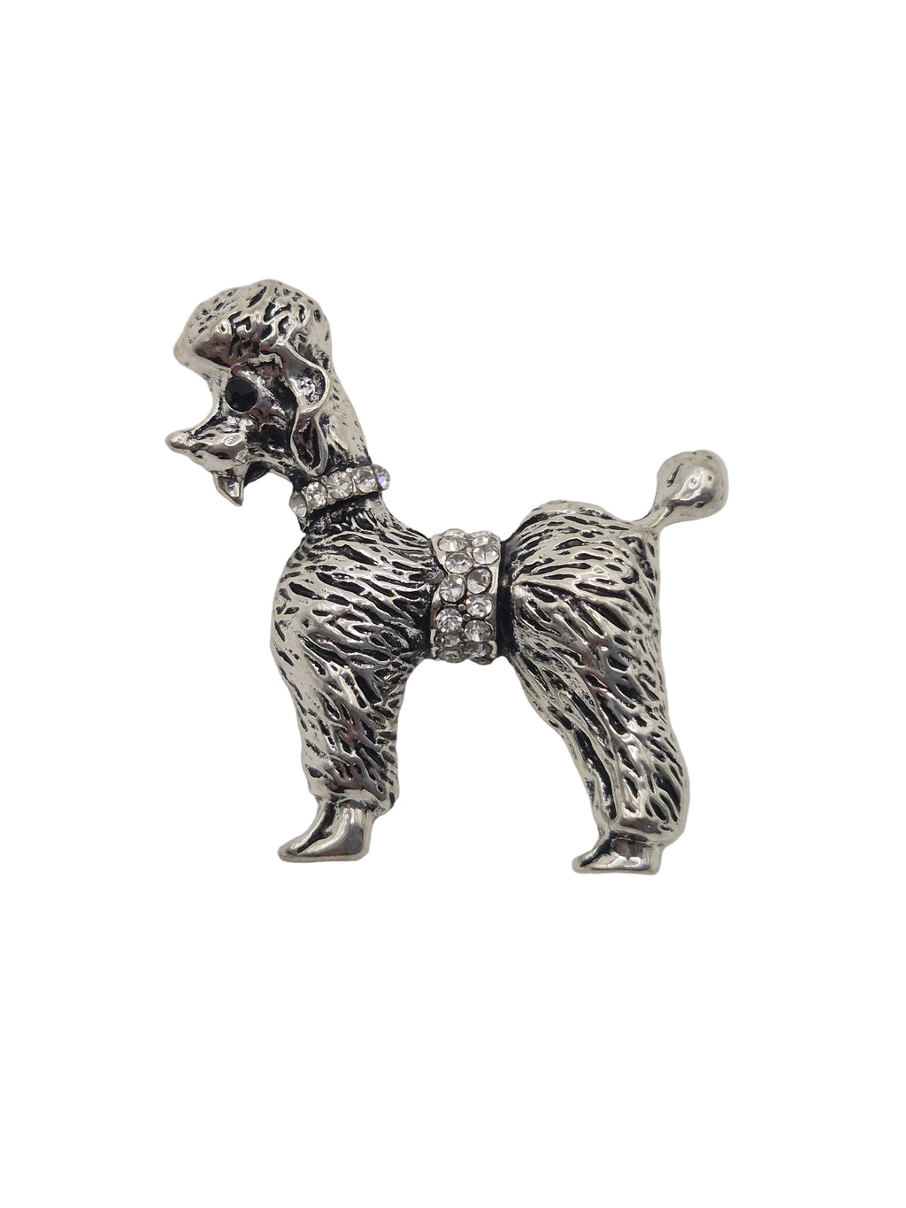 A silver-tone metal dog-shaped brooch or pin with textured fur detailing and a small rhinestone belt, shown on a plain white background.