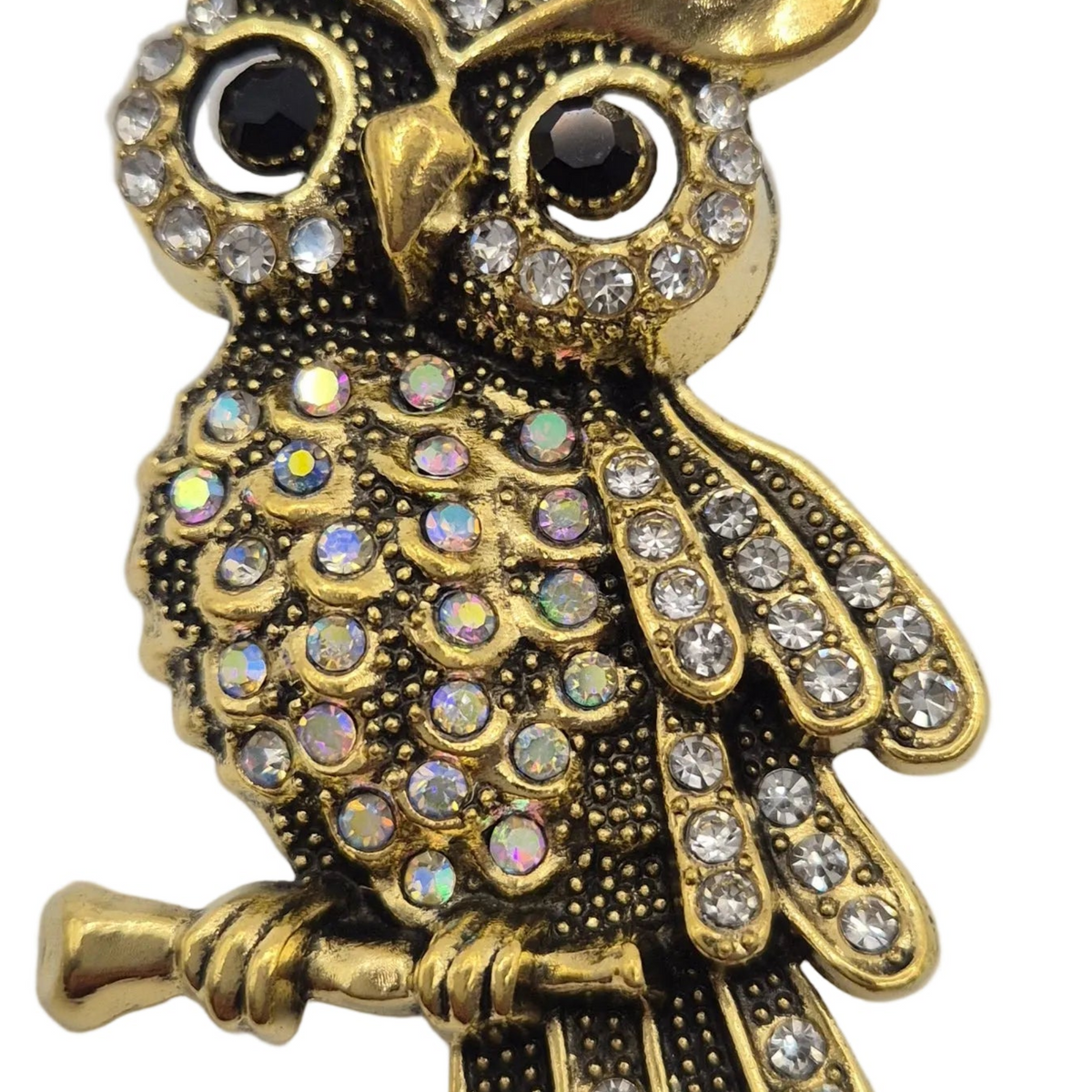 Gold-toned owl brooch embellished with clear rhinestones and iridescent round crystals, shown on a plain white background.