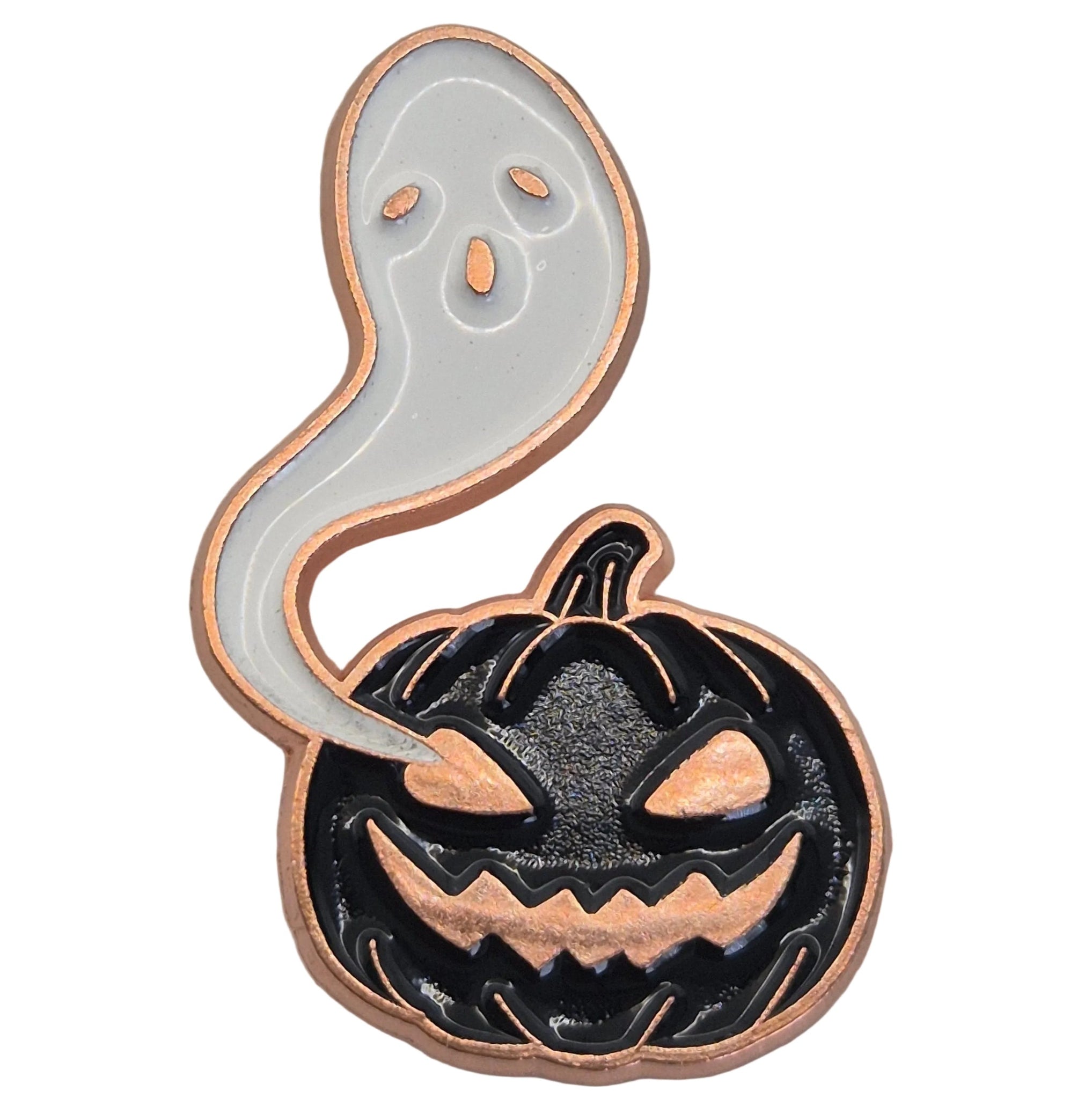 A Halloween-themed enamel pin featuring a black jack-o'-lantern pumpkin with a copper-toned outline and a white ghost floating above it, also outlined in copper, shown on a white background.