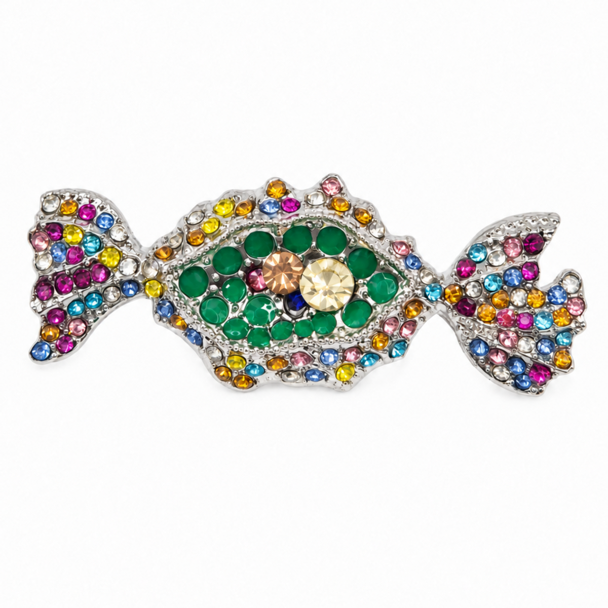 A candy-shaped brooch or pin featuring a silver-tone metal base densely encrusted with multicolored rhinestones, including green, pink, blue, yellow, and orange, with a central faceted gold crystal.