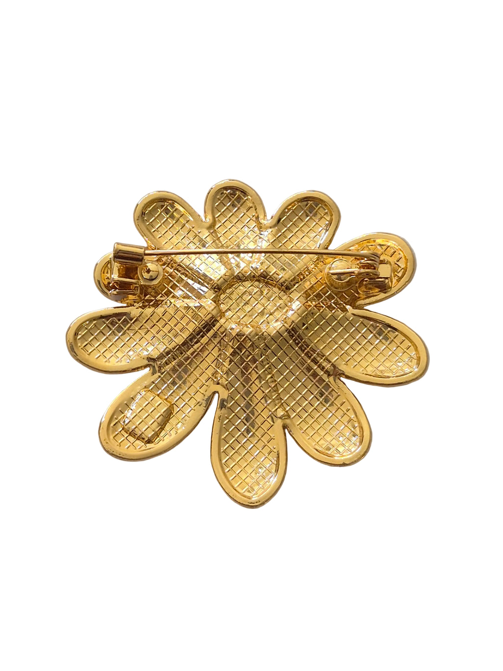 Daisy brooch on a white background