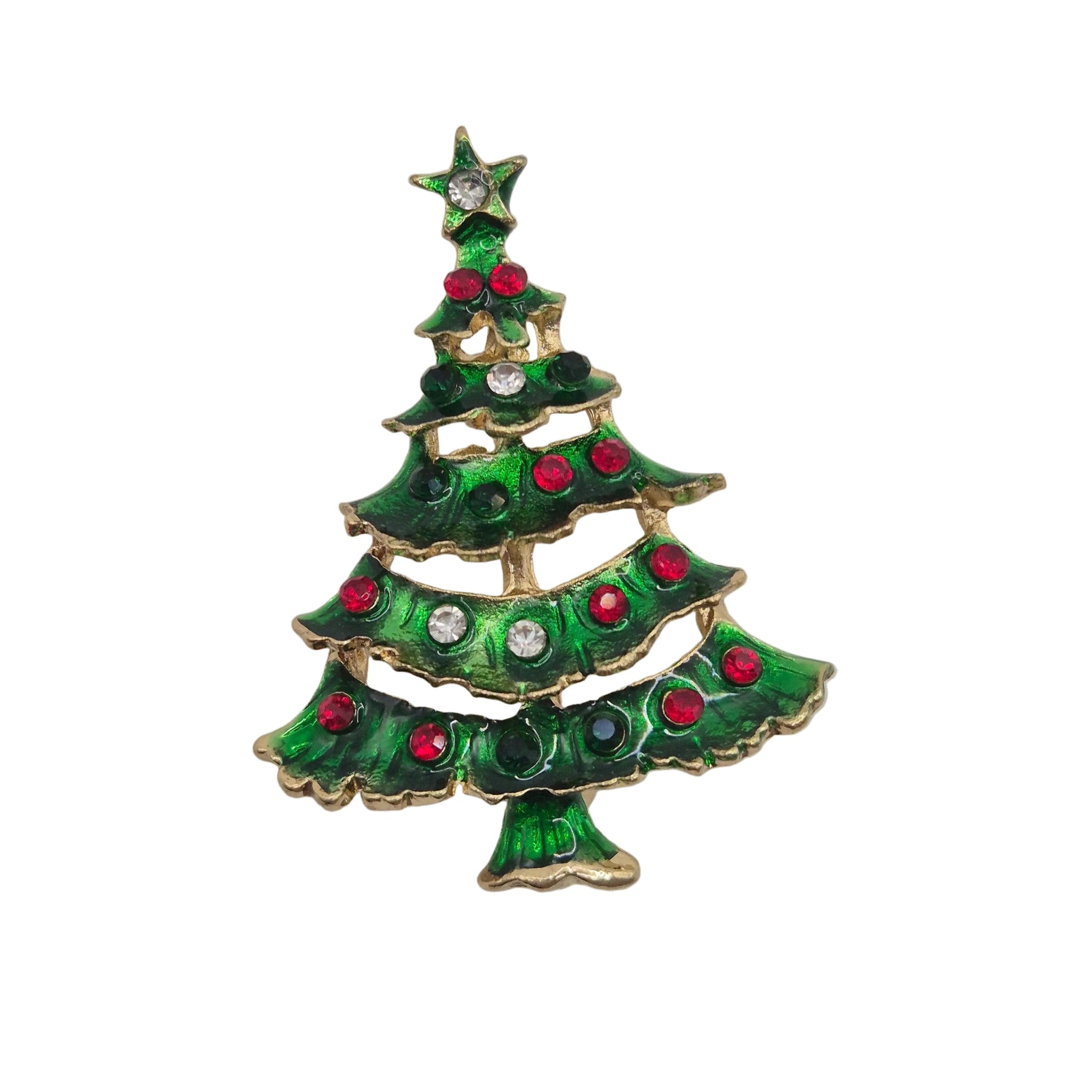 A Christmas tree-shaped brooch with green enamel, gold-tone metal trim, and red and clear rhinestone embellishments, shown on a plain white background.