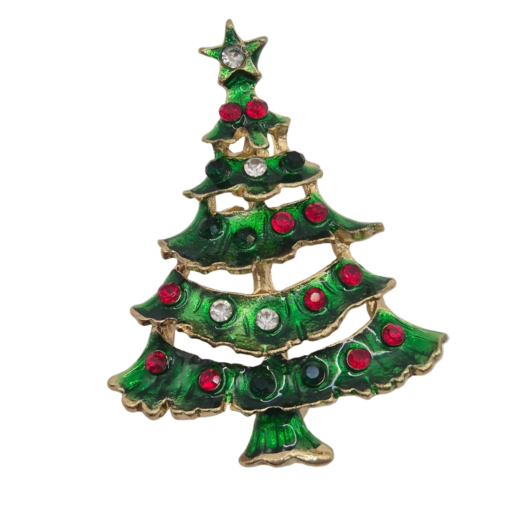 A Christmas tree-shaped brooch with a gold-tone metal outline, green enamel fill, and red and clear rhinestone decorations, isolated on a white background.