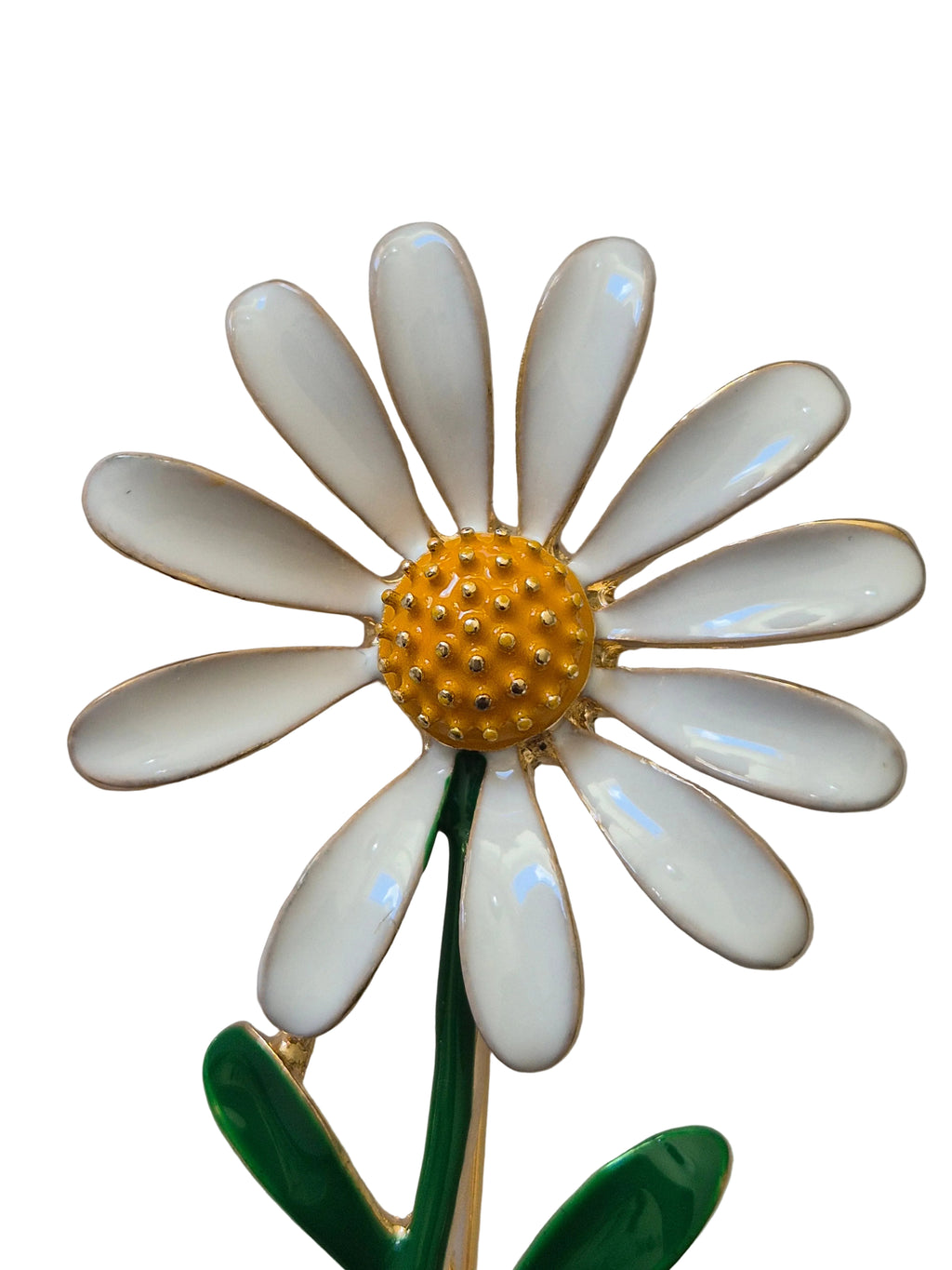 White daisy flower brooch with a yellow center on a white background