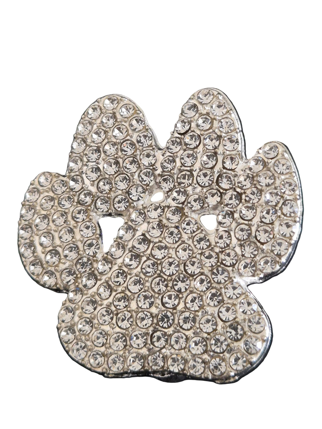 Decorative paw print brooch with rhinestones on a white background