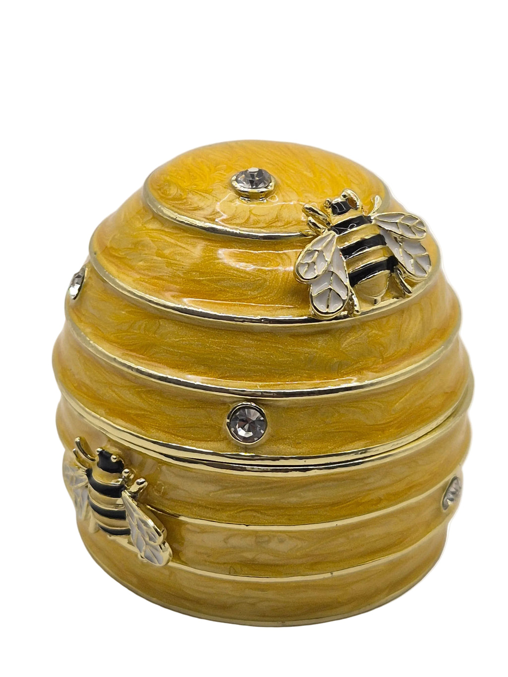 Decorative yellow beehive trinket pot with bee designs on a white background