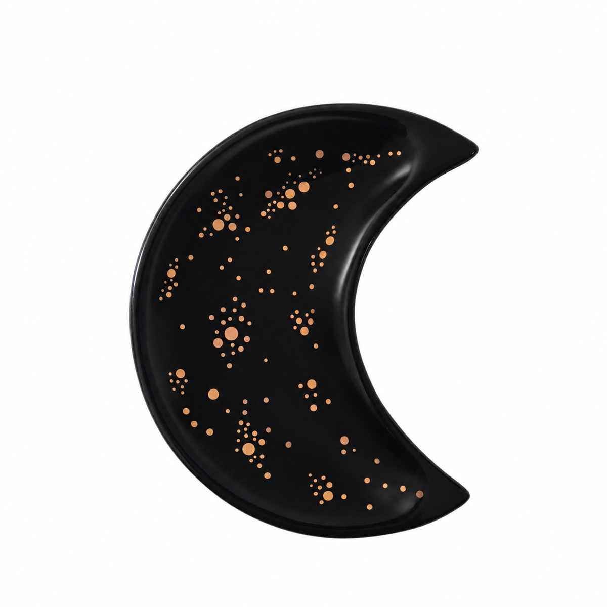 A crescent moon-shaped black tray decorated with metallic rose gold star and dot patterns, shown against a plain white background.