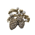 A vintage-style pinecones and evergreen branch brooch in gold-tone metal, embellished with clear rhinestones on the pinecones and white faux pearls.