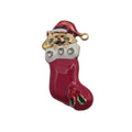 A Christmas stocking brooch featuring a gold cat wearing a red Santa hat, with three clear rhinestones on the white cuff and a red boot-shaped lower section decorated with green and red details, set against a plain white background.