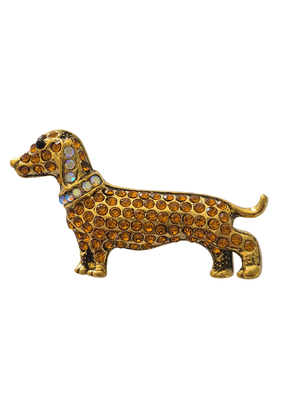Dog-shaped brooch with brown and gold details on a white background
