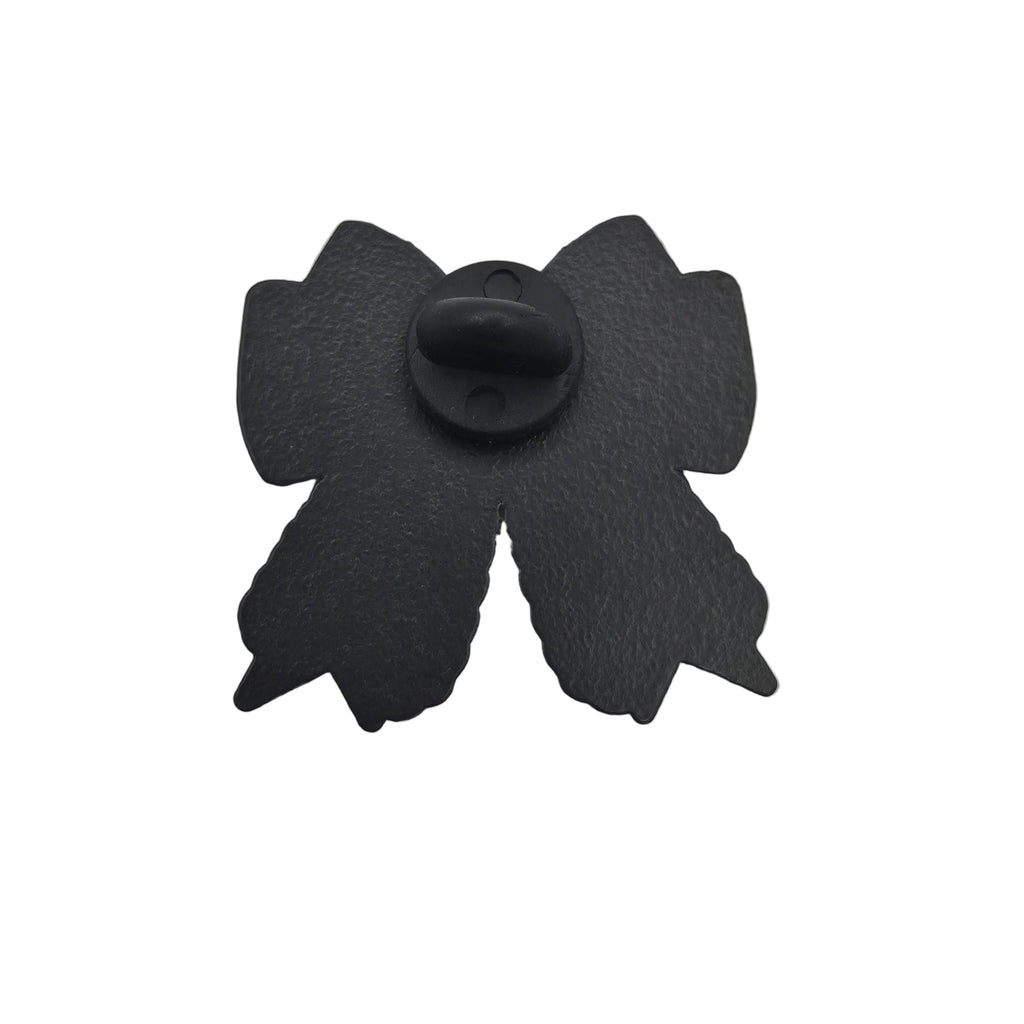 A black metal bow-shaped pin shown from the back on a plain white background.