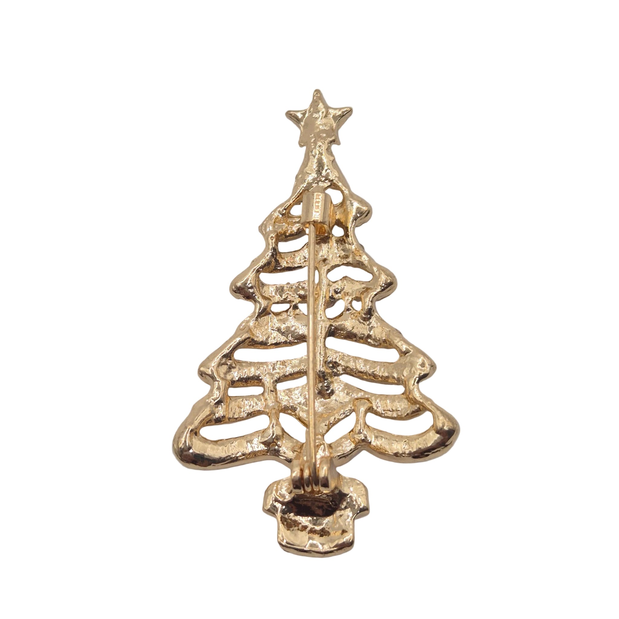 A gold Christmas tree-shaped brooch with an openwork design and a star on top, shown against a plain white background.