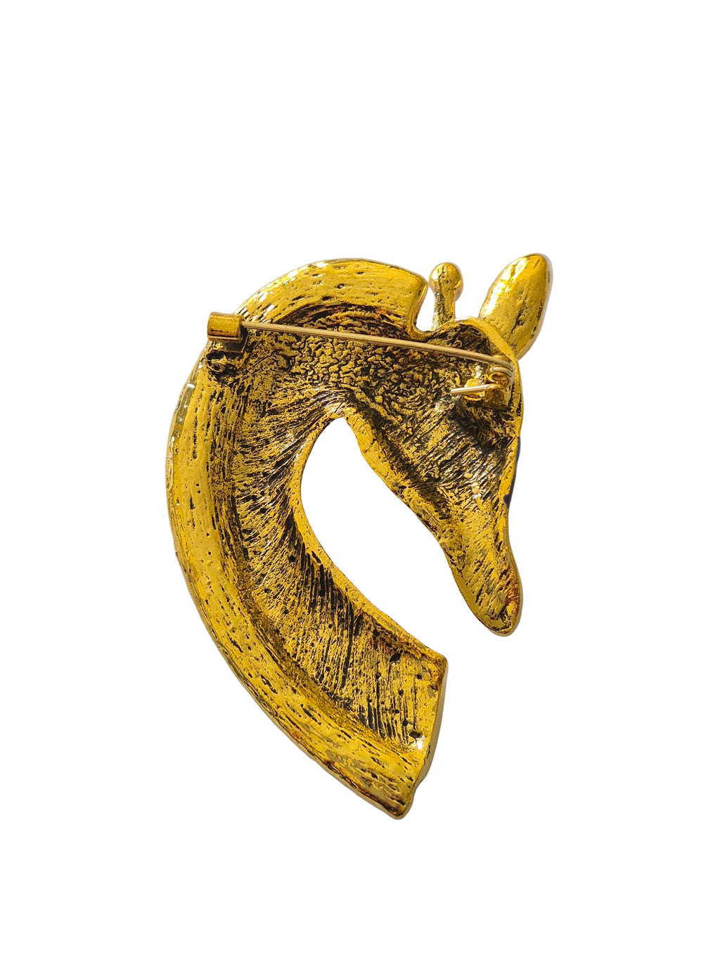 Gold giraffe head brooch on a white background
