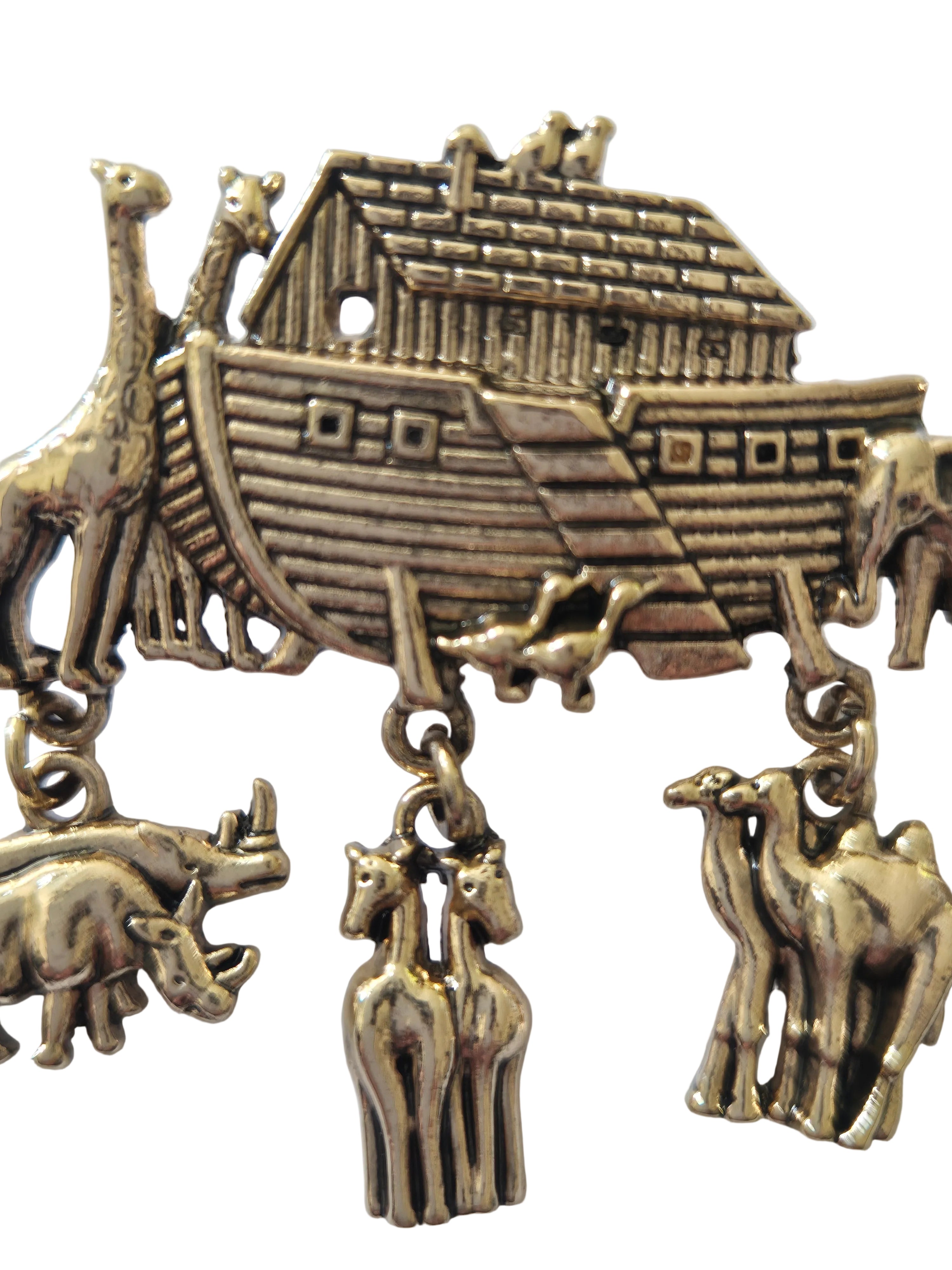 gold-colored charm brooch with Noah's Ark and animals on a white background