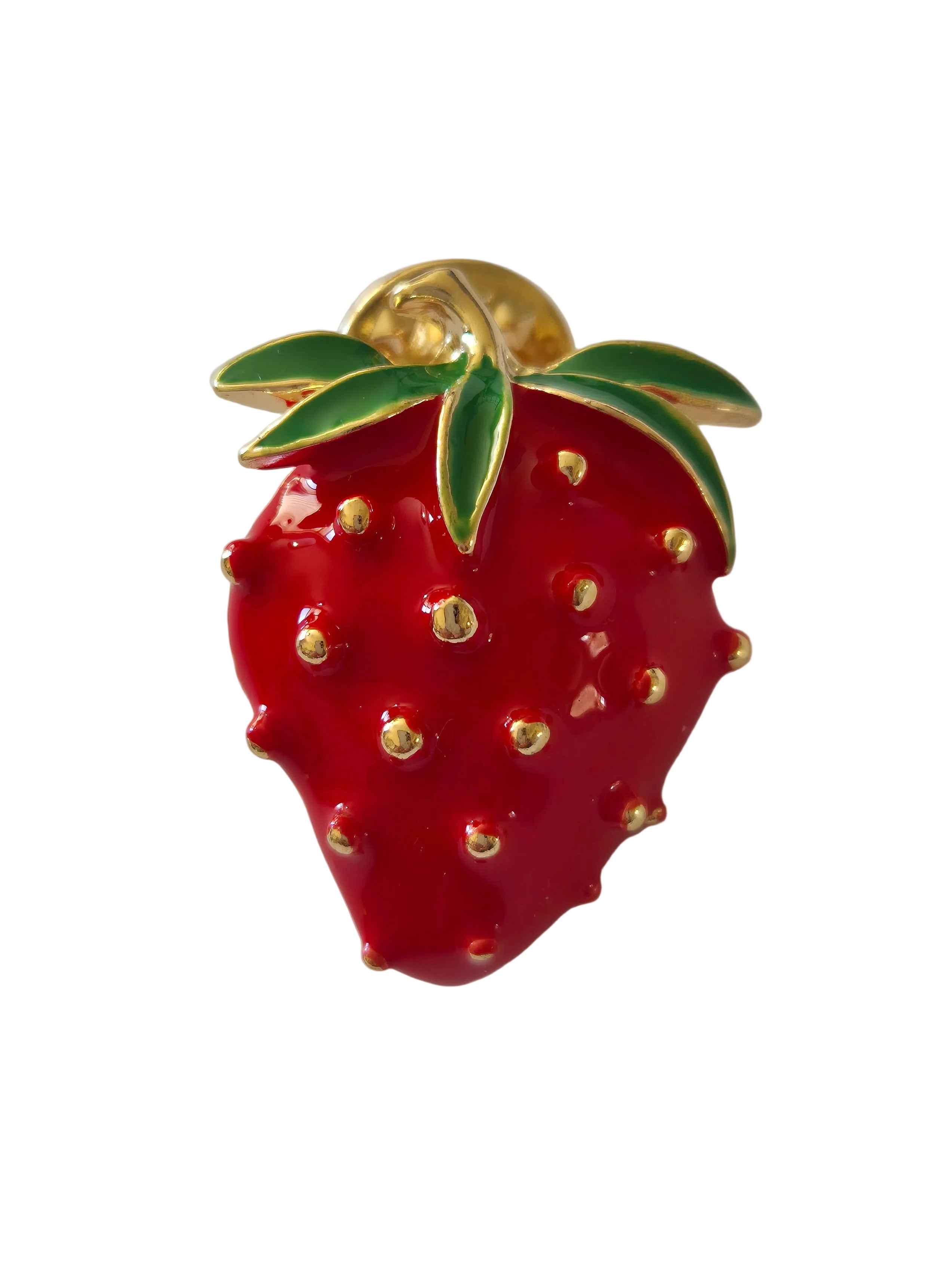 Red strawberry-shaped brooch with gold accents on a white background