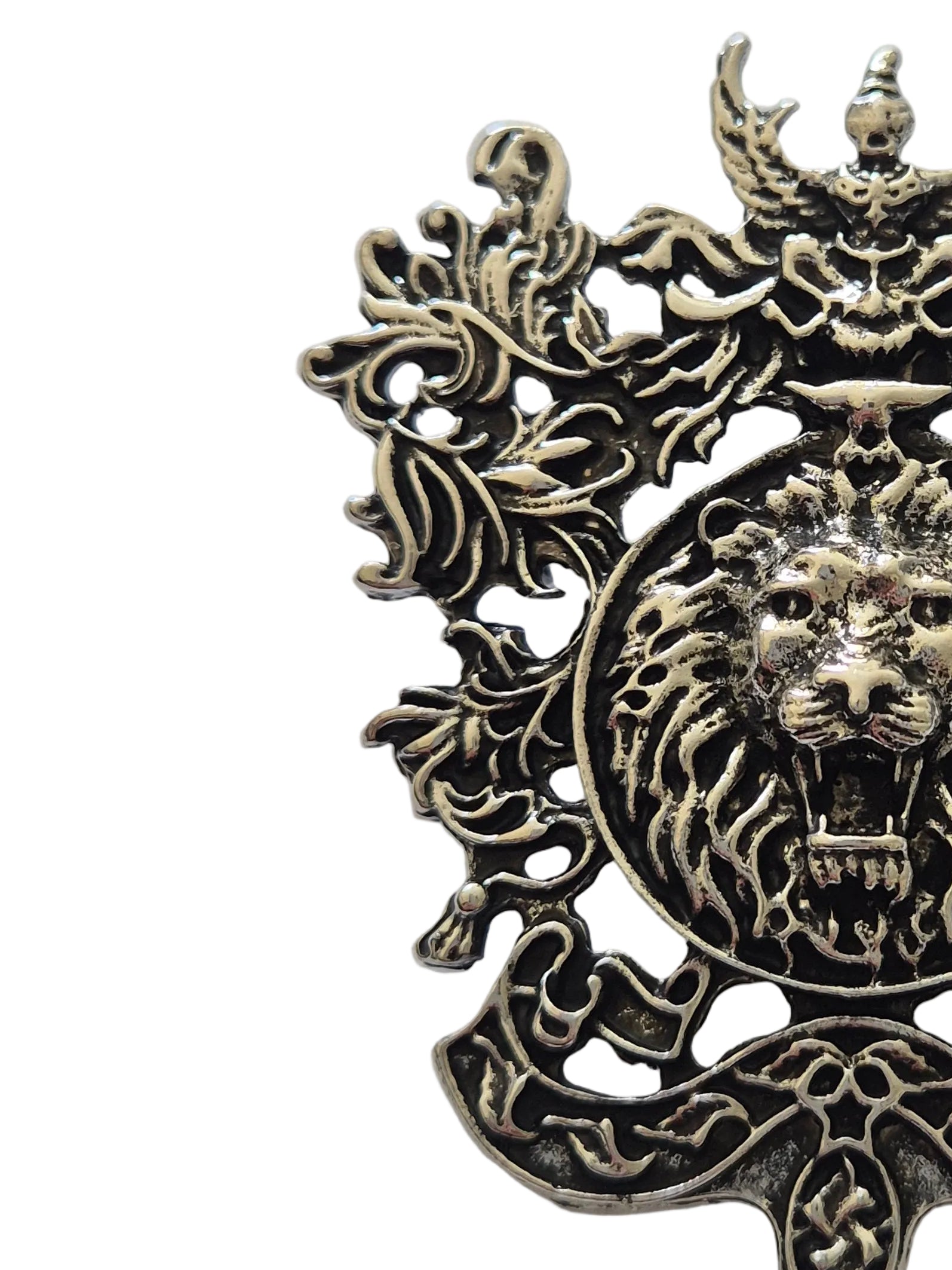 silver metal brooch lion emblem on a white background