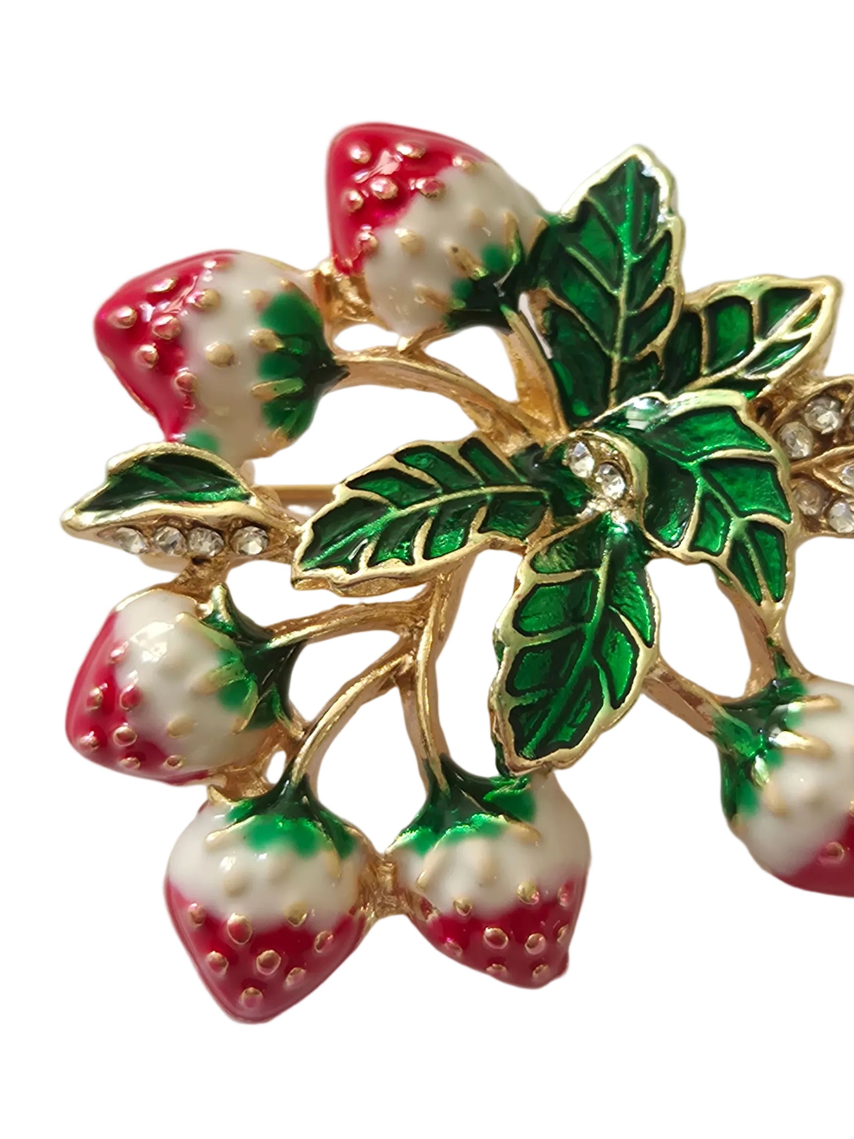 Decorative brooch with strawberry design on a light gray background