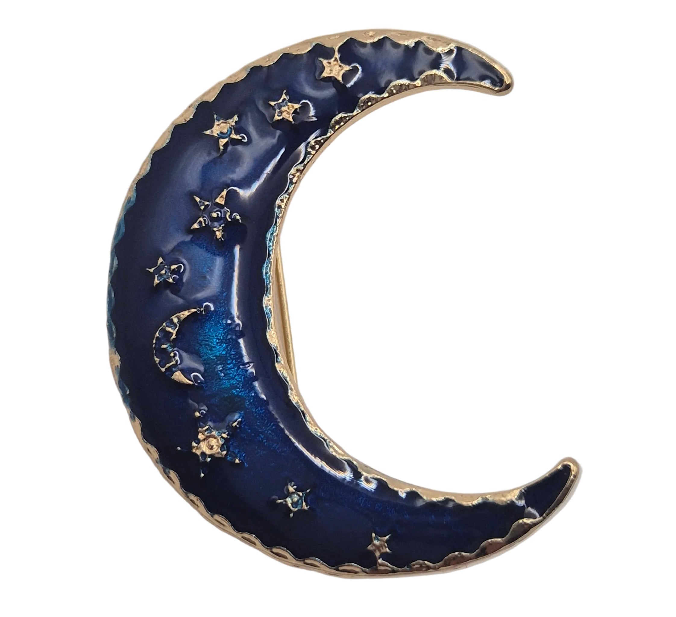 A crescent moon-shaped brooch or pin featuring a deep navy blue enamel background with gold-toned stars and a scalloped gold border, shown on a plain white background.