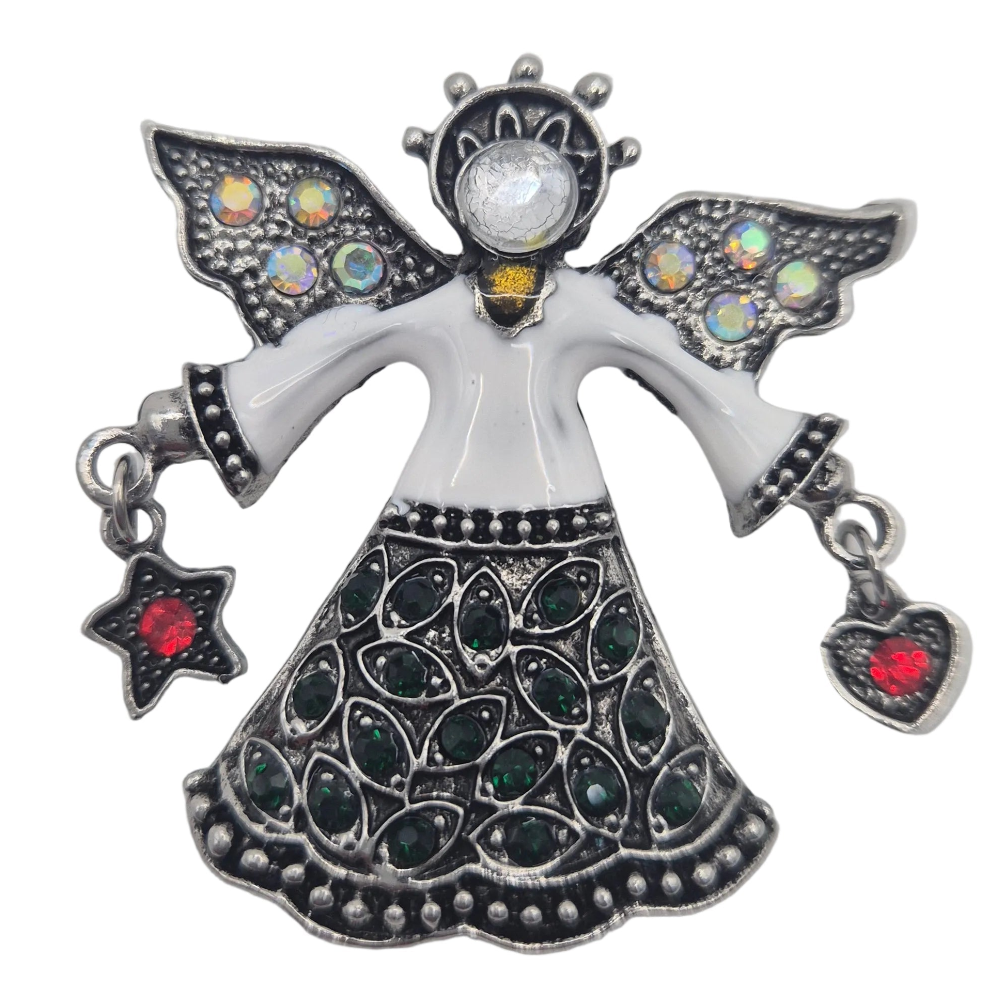 A silver-toned angel brooch featuring a white enamel body, dark green teardrop stones on the skirt, iridescent stones on the wings, and red heart and star accents hanging from the hands, shown on a plain white background.
