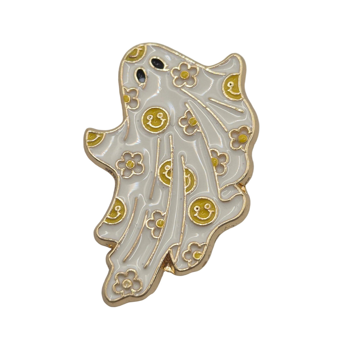 A ghost-shaped enamel pin with a white enamel body, gold metal borders, yellow smiley faces, and small gold flowers, shown on a plain white background.