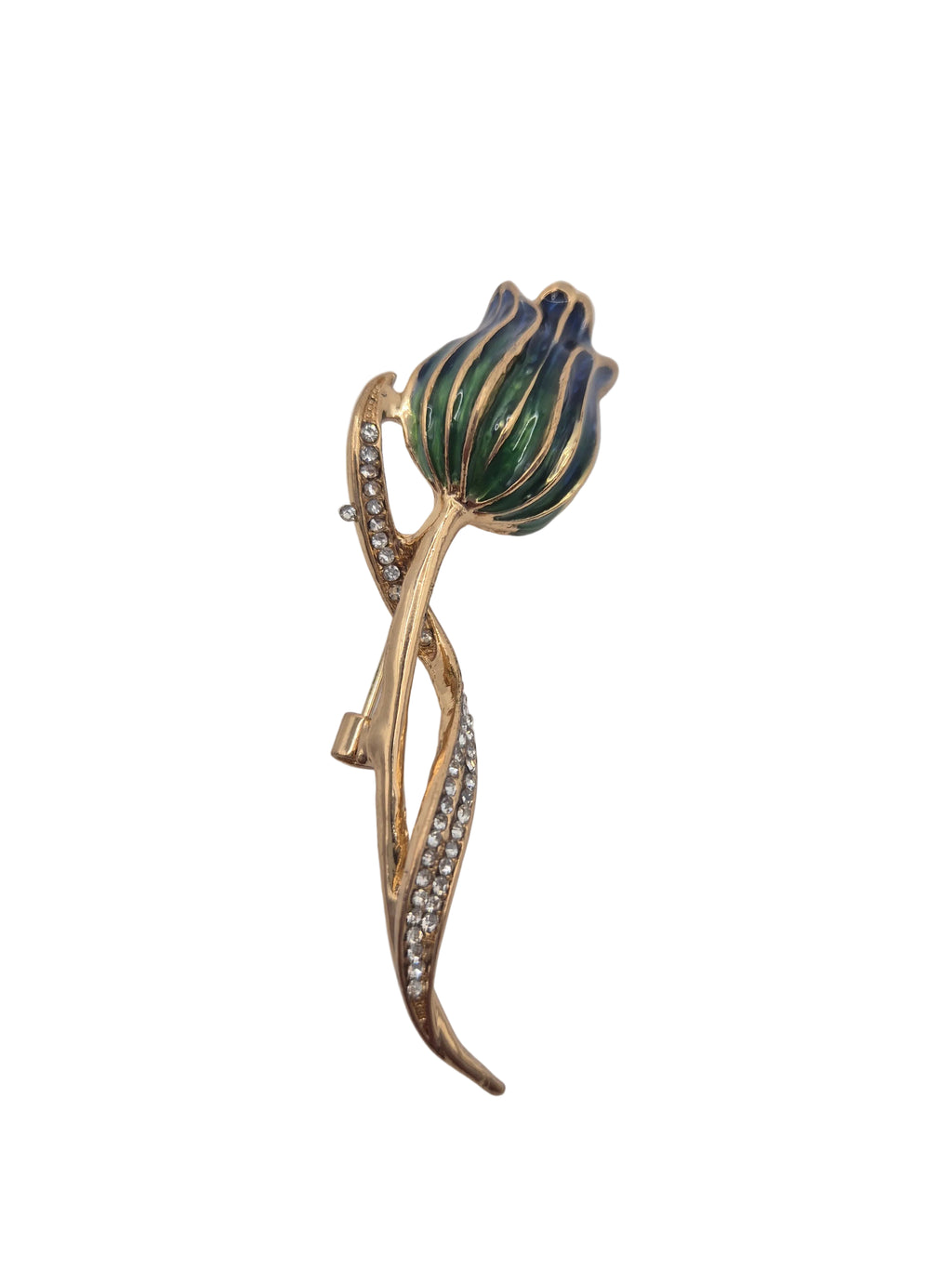 Gold and green brooch with floral design on a white background