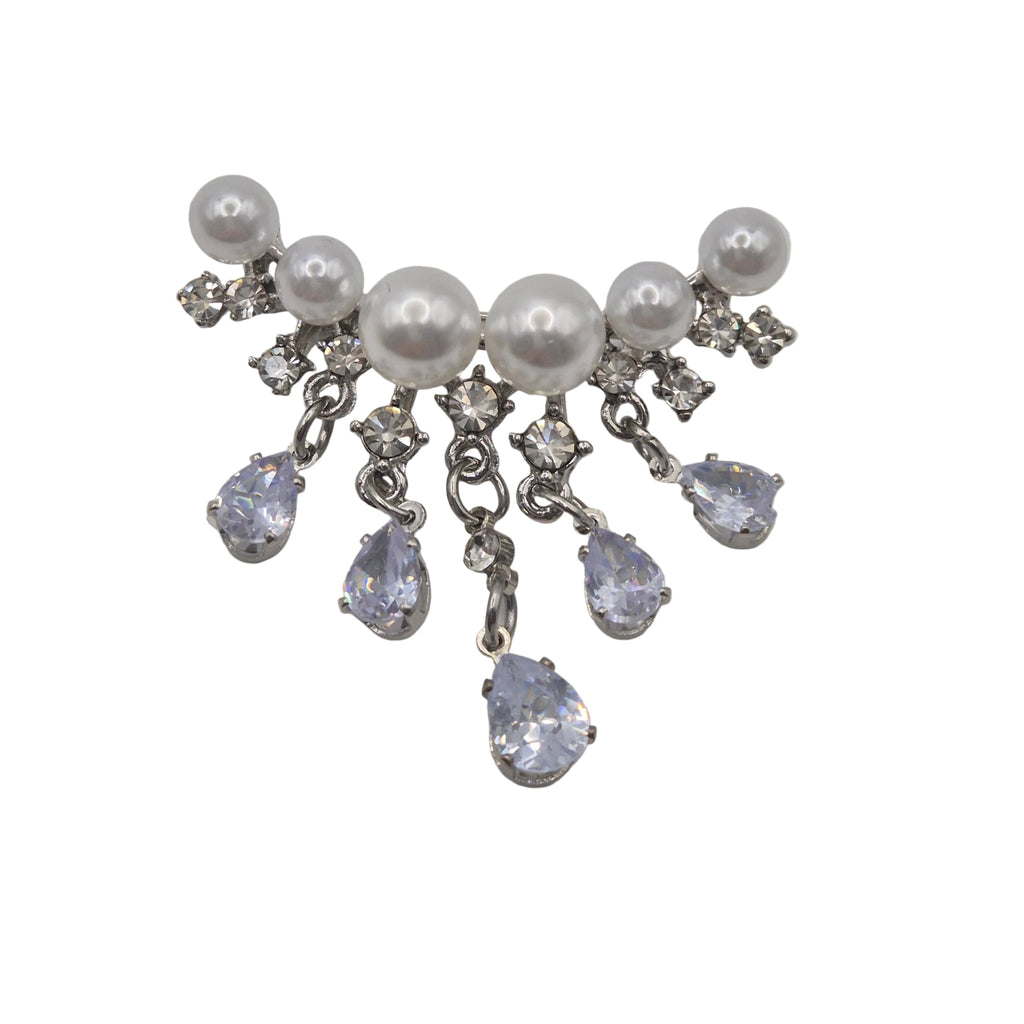 A silver-tone dangle brooch featuring white faux pearls and clear rhinestones, with five teardrop-shaped clear rhinestones hanging from silver chains, set against a plain white background.