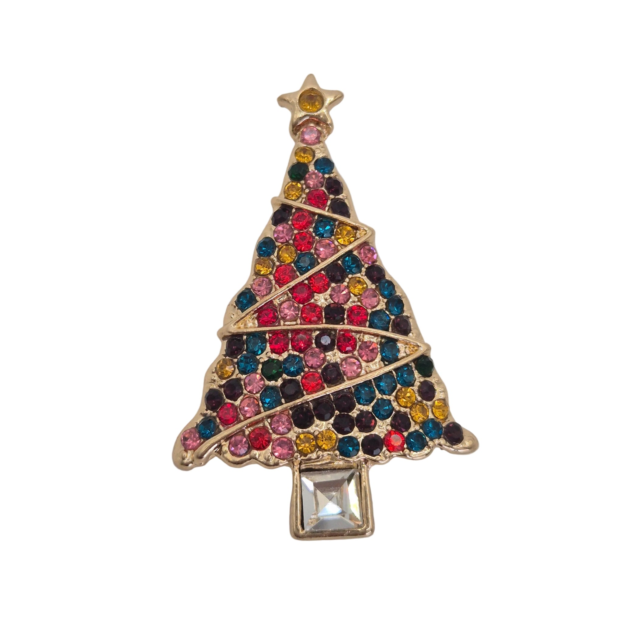 A gold Christmas tree brooch embellished with multicolored rhinestones and a clear square crystal at the base, shown on a plain light gray background.